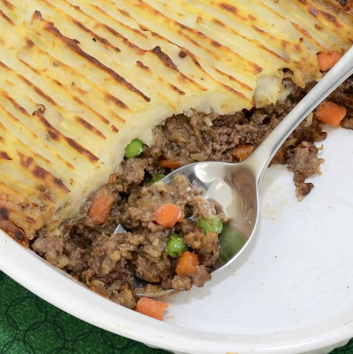 Guinness Shepherd's Pie with Beef in a white casserole dish