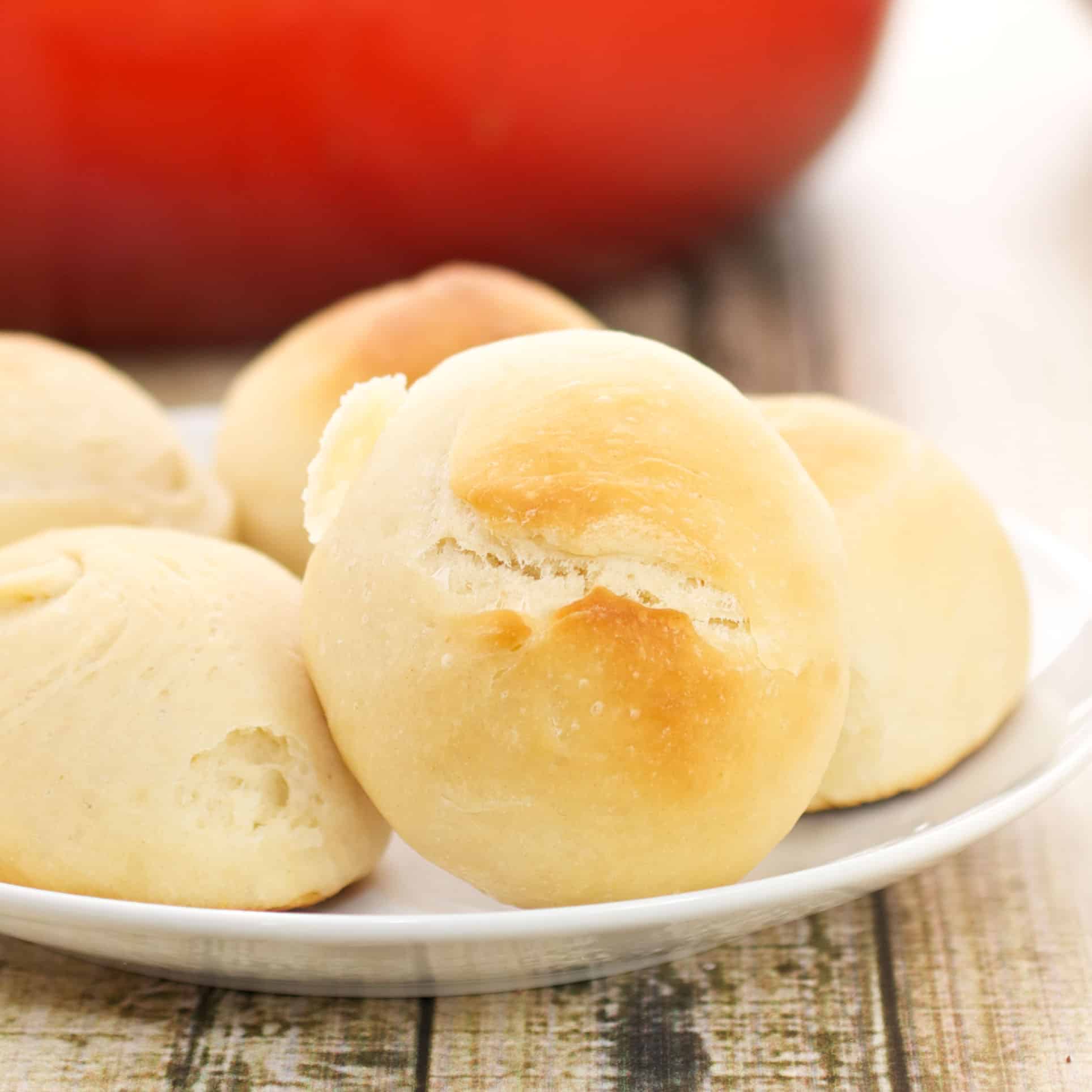 fluffy dinner rolls on a plate