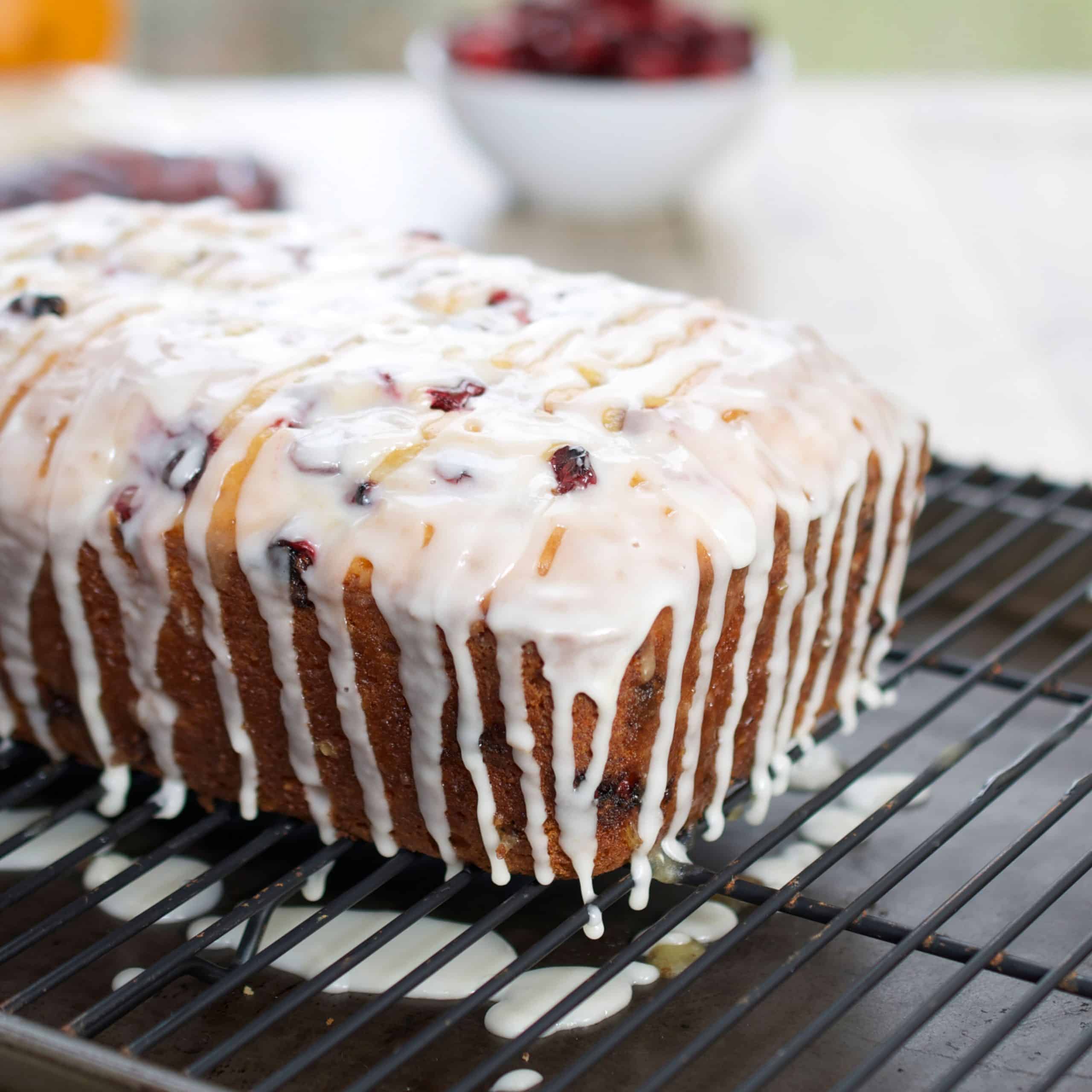 Cranberry Orange Bread with Simple Glaze on a cooling rack