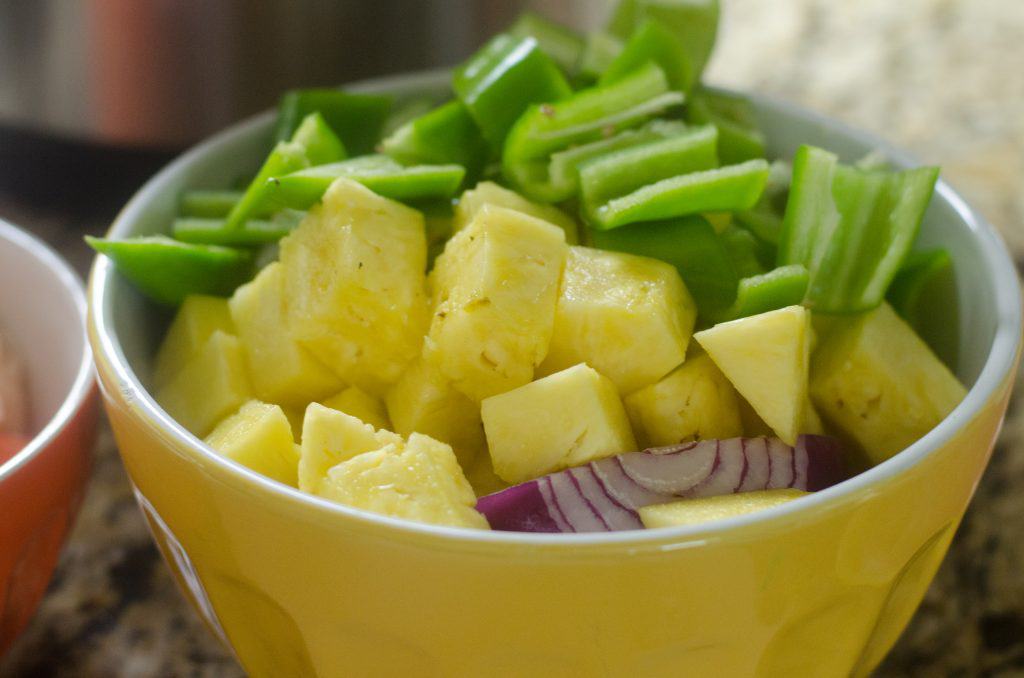 veggies and fruit in a yellow bowl