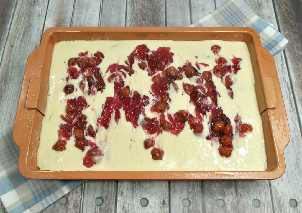 cherry cheesecake brownies in a pan