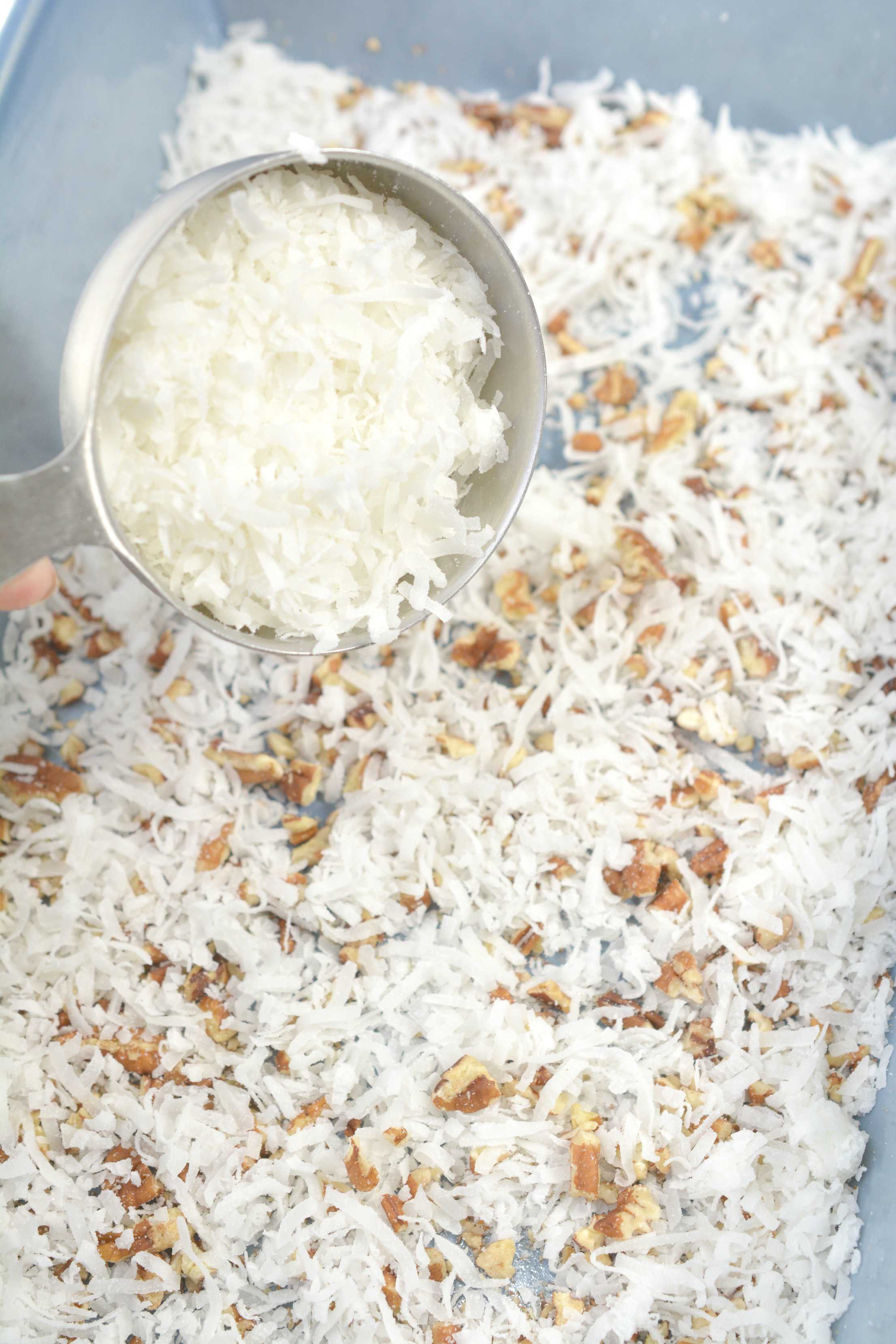 coconut in the pan over the pecans