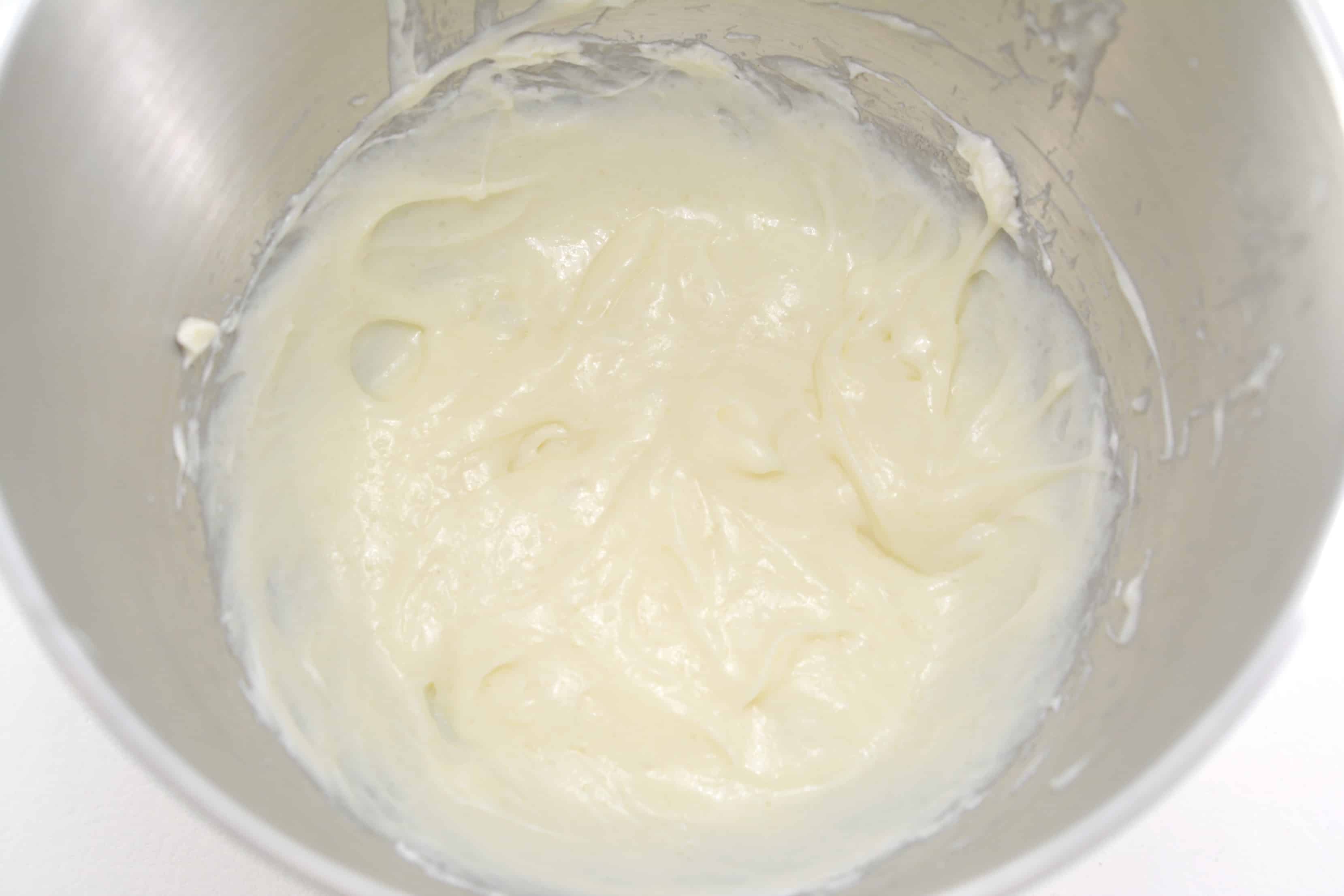 cream cheese whipped in a mixing bowl