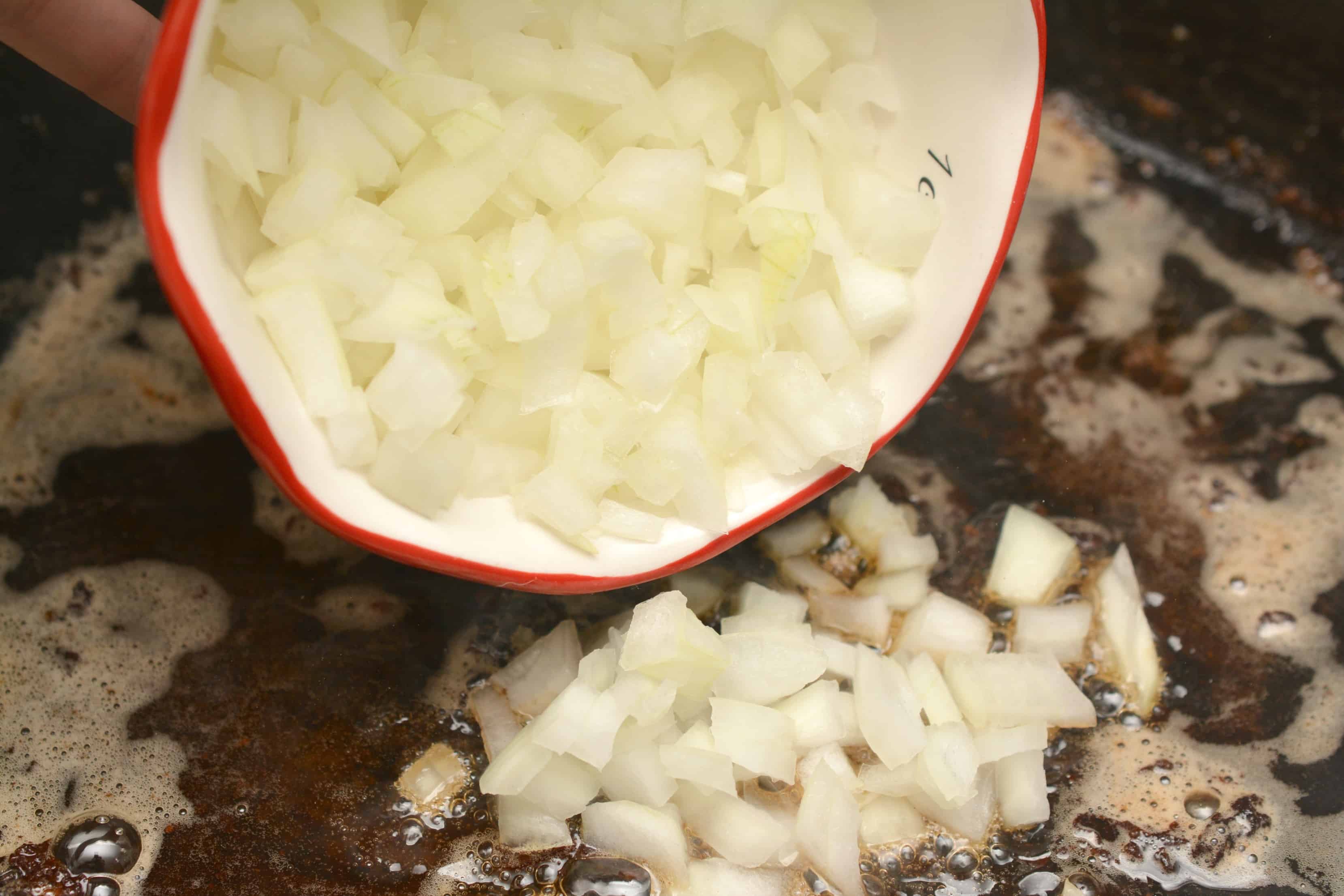 diced onions in pan