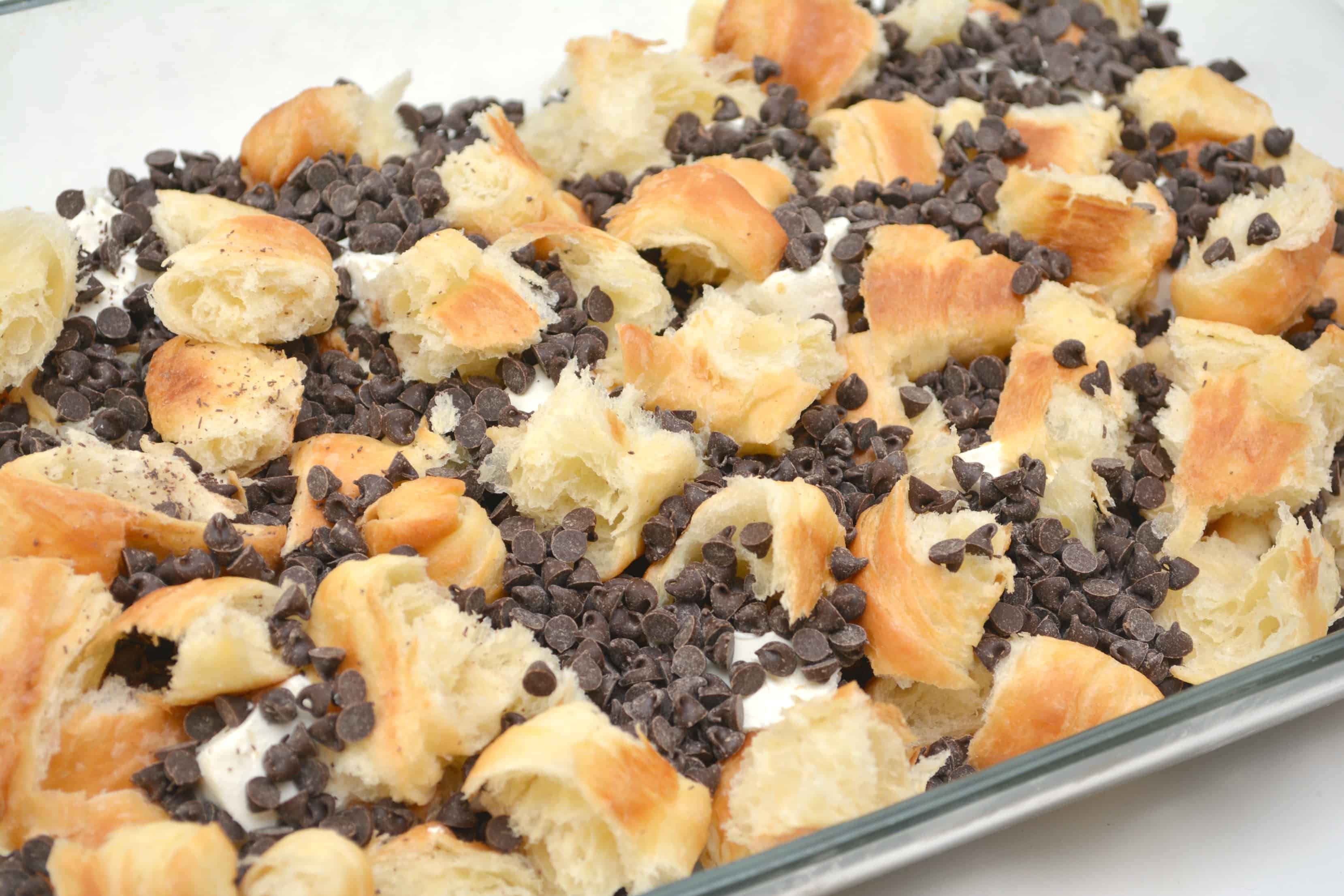 Chocolate chips and Croissants in a baking dish