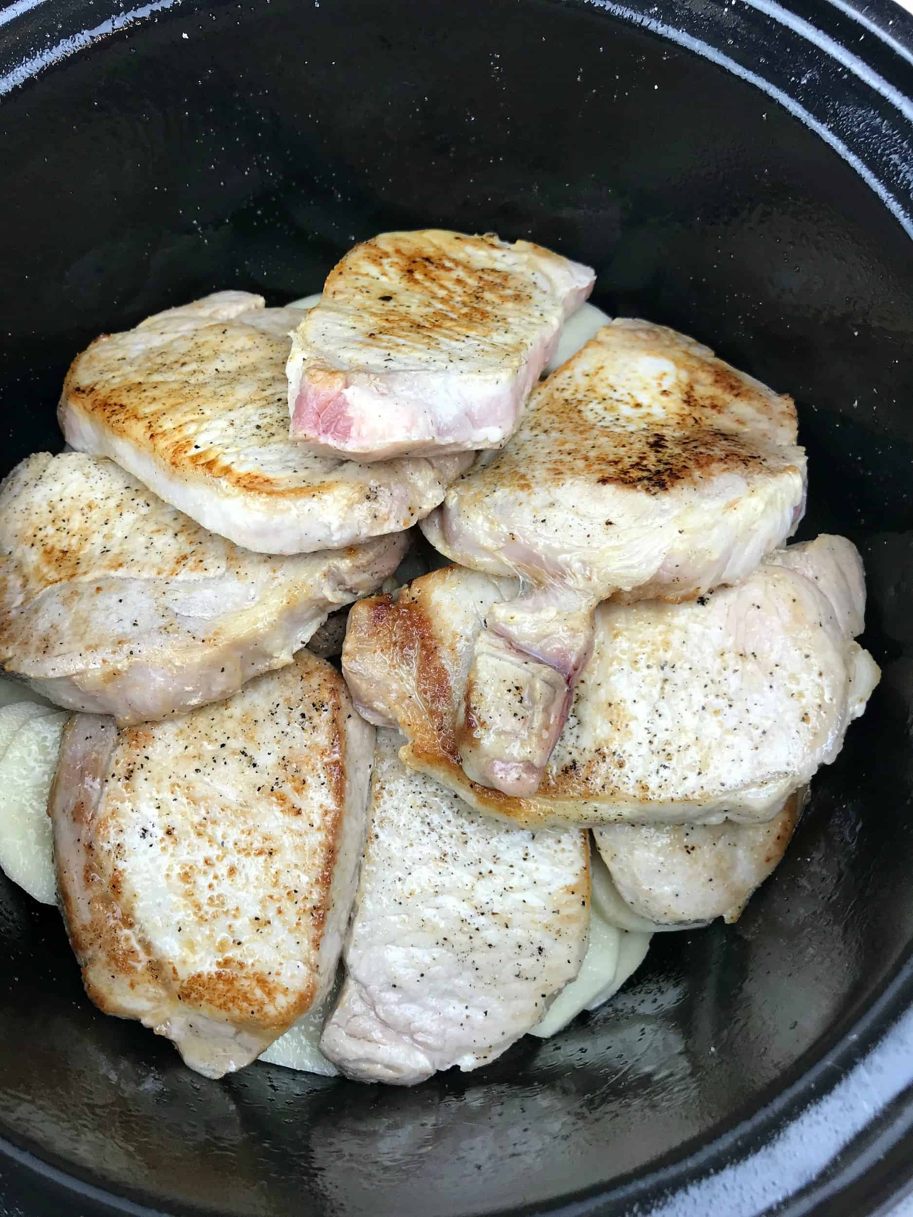 seared pork chops in a slow cooker