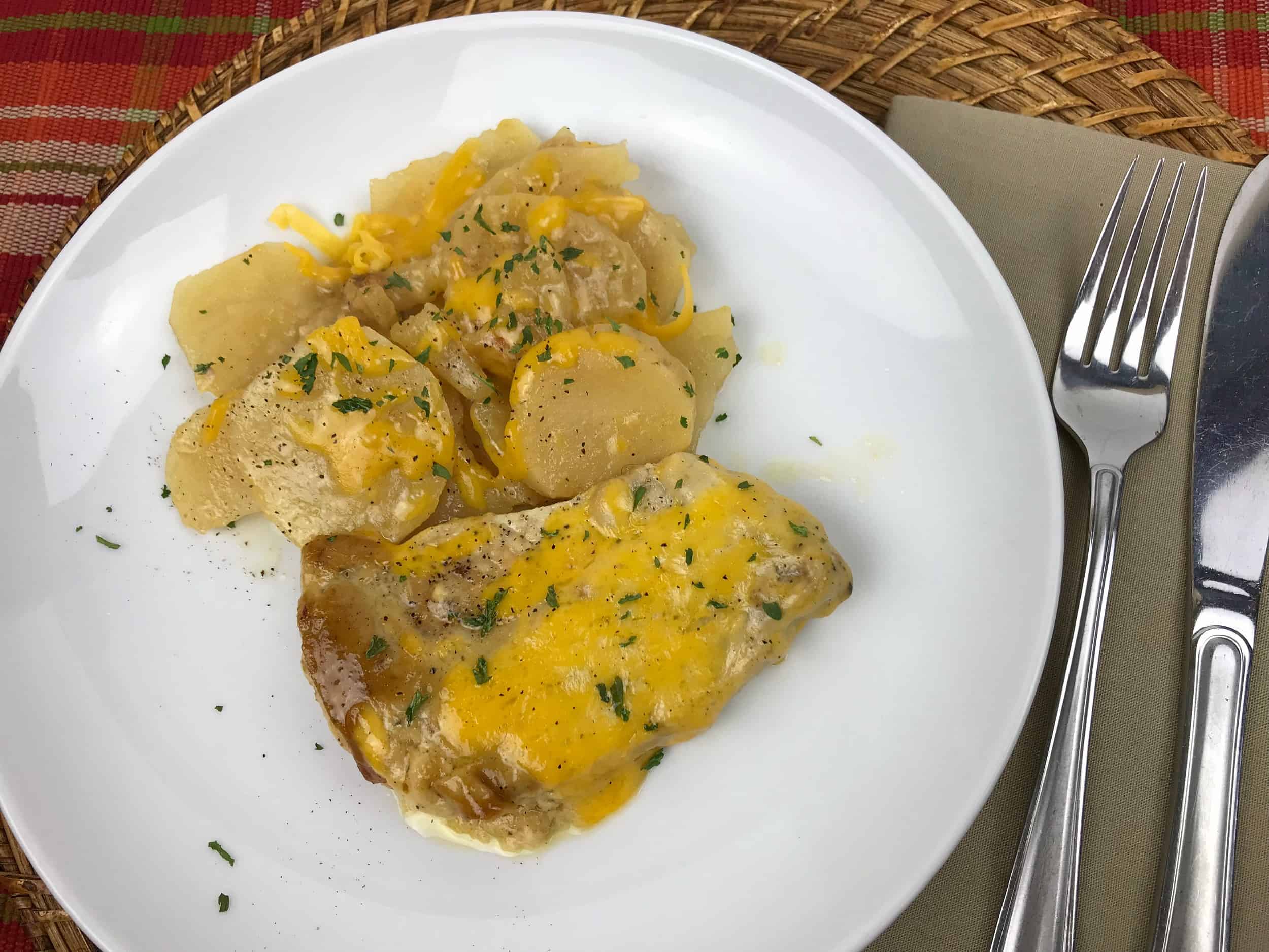 pork chop and potatoes on a plate 