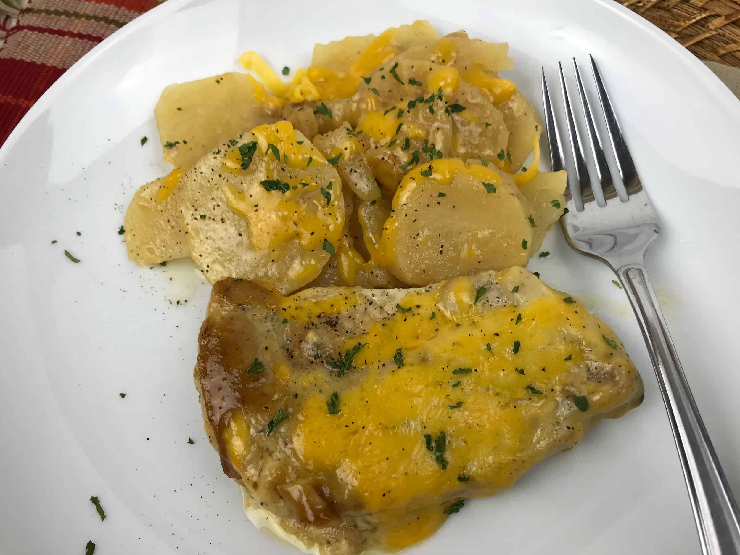 Slow Cooker Pork Chops and Potatoes on a plate 