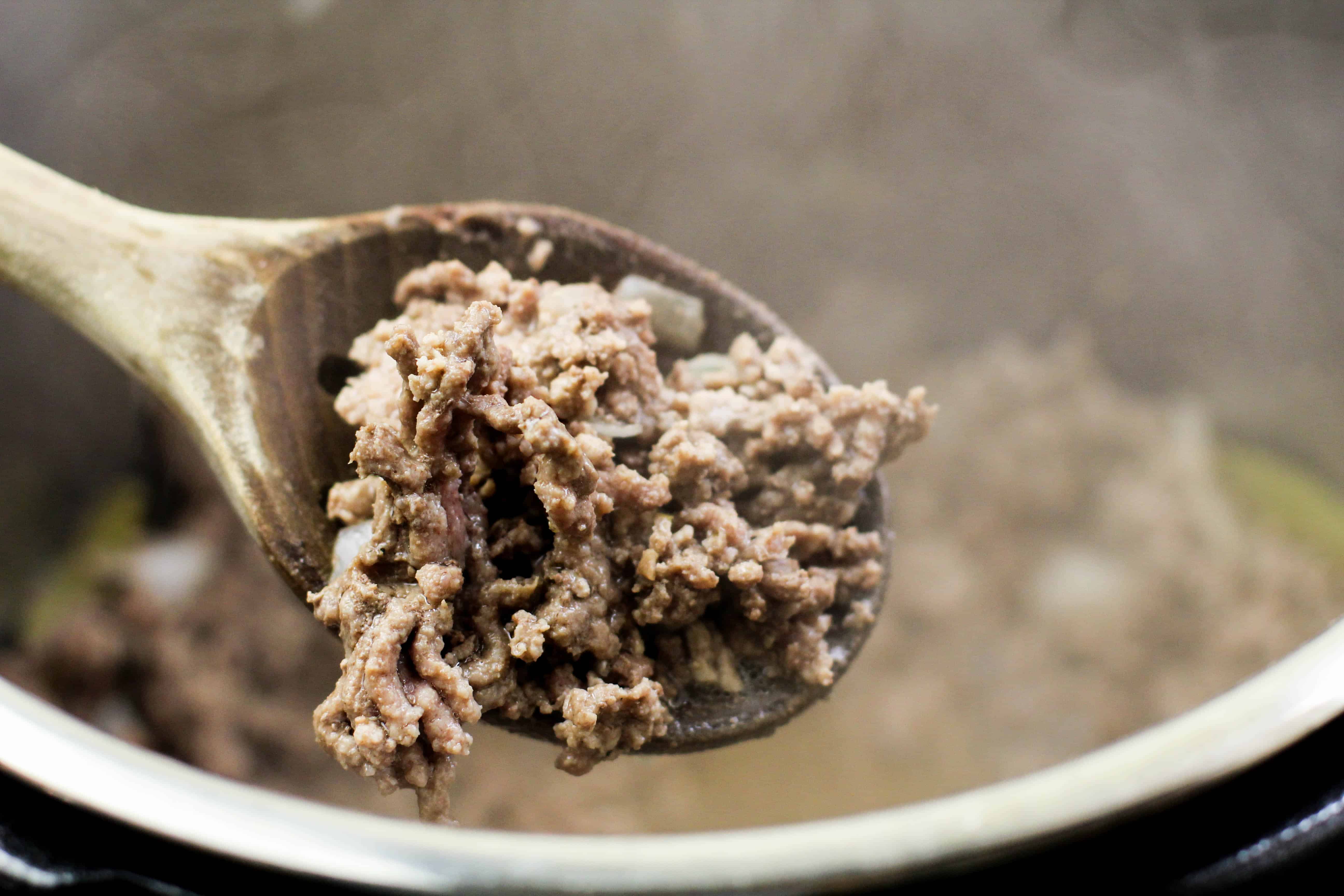 ground beef cooked on a spoon