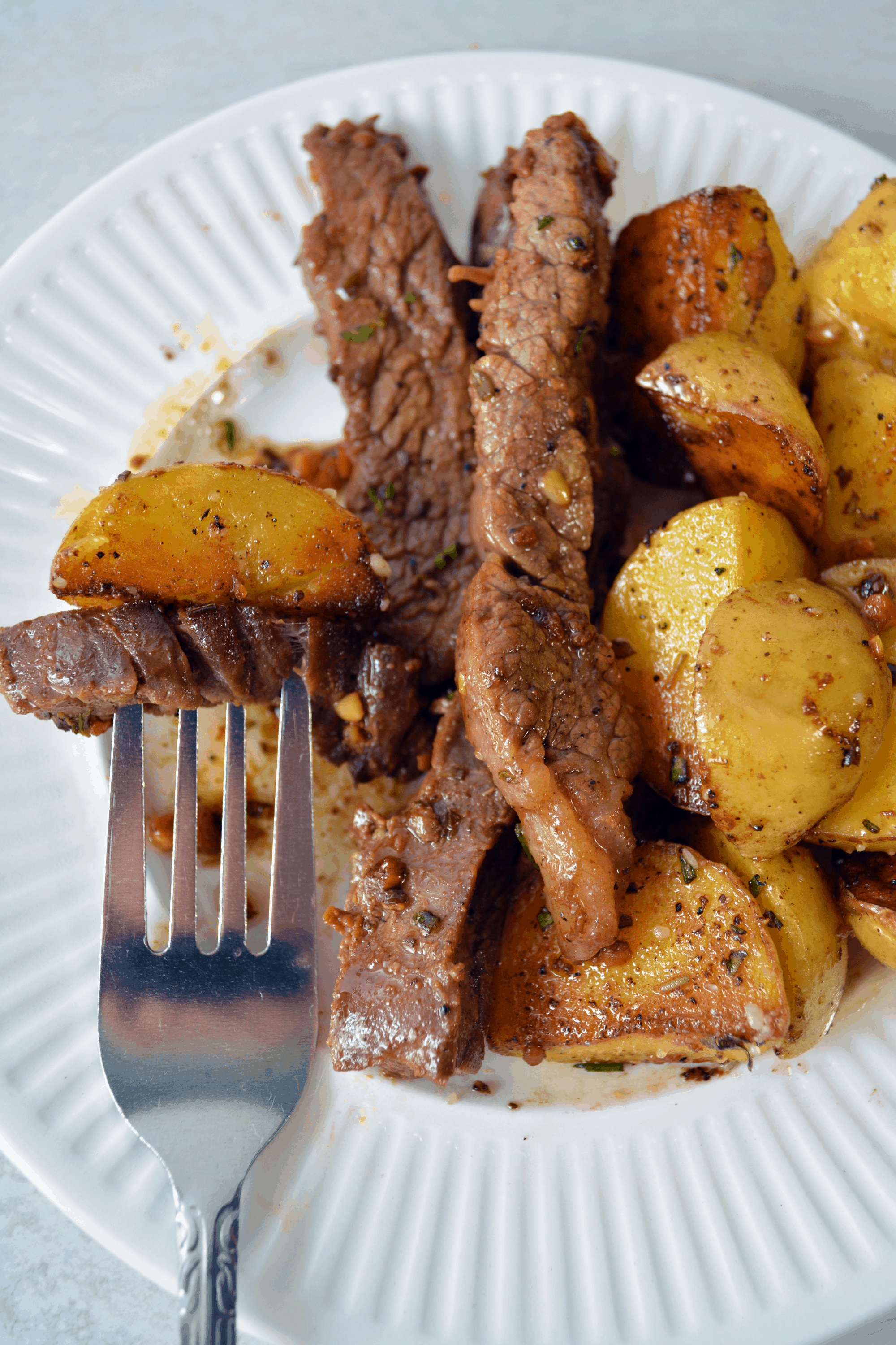 steak and potatoes on a plate 