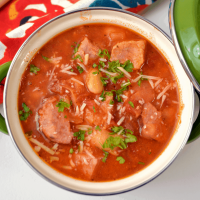 Overhead picture of instant pot sausage and bean soup in a small crock for serving