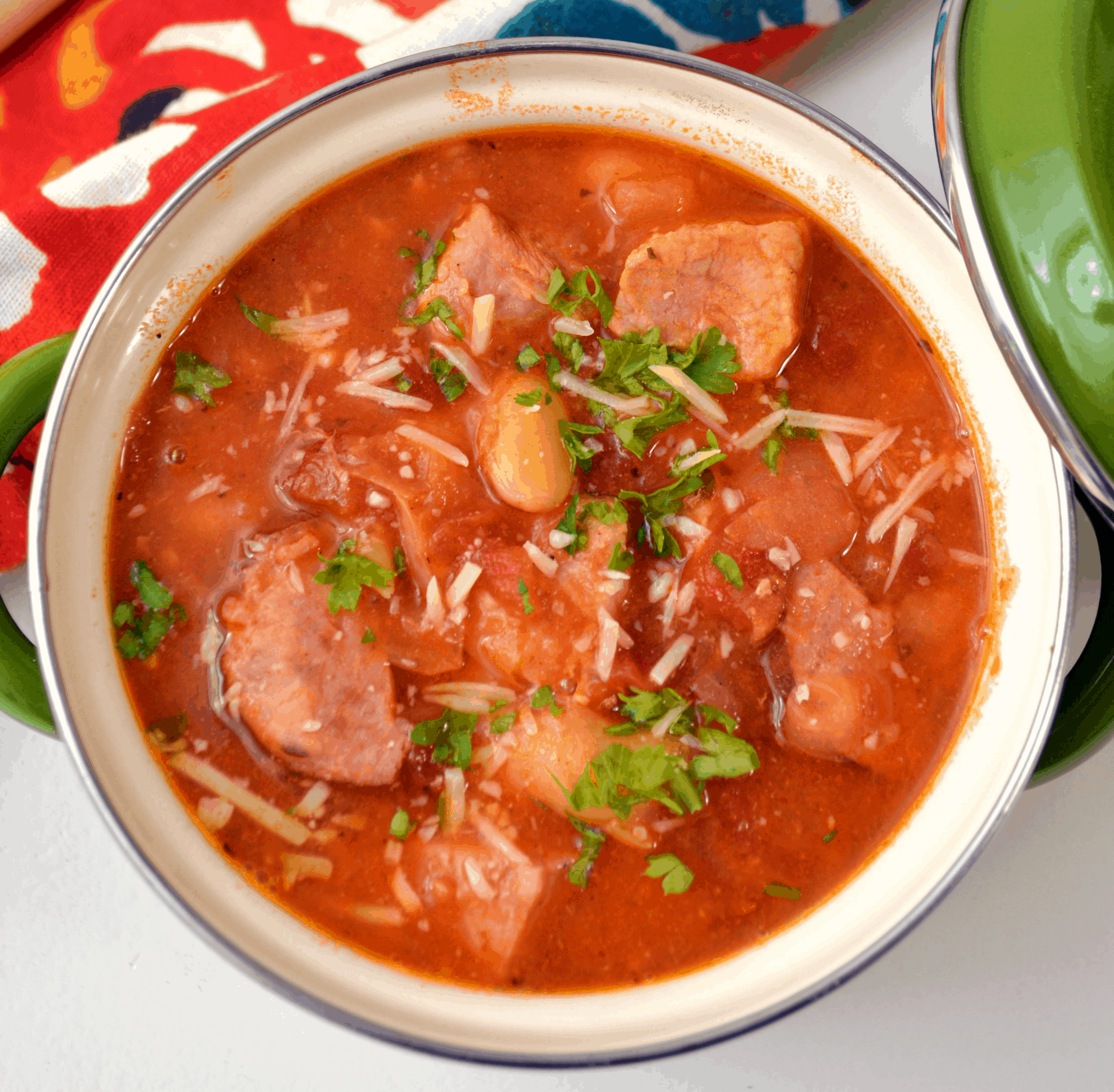 Overhead picture of instant pot sausage and bean soup in a small crock for serving