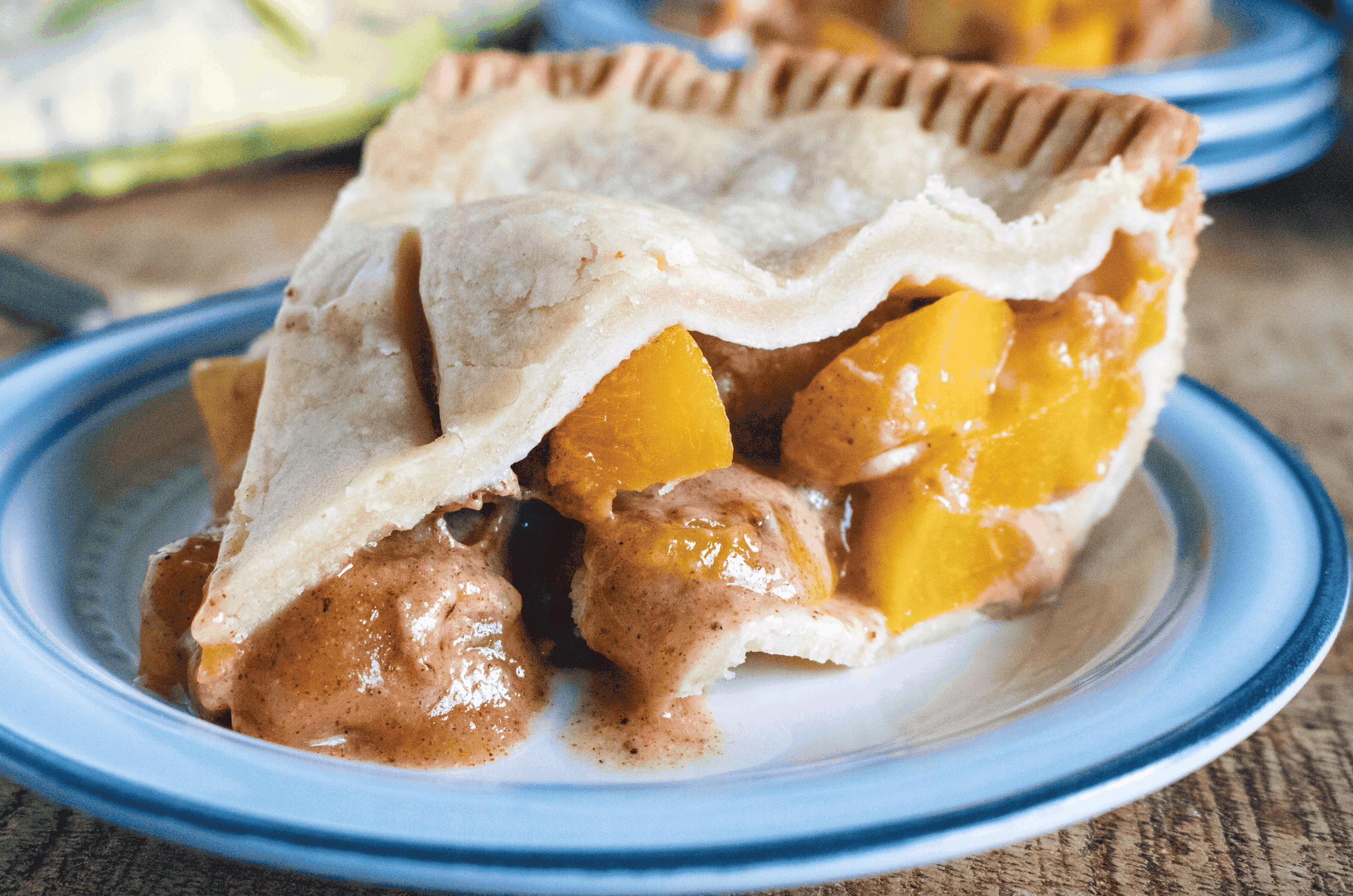 slice of peach pie on plate