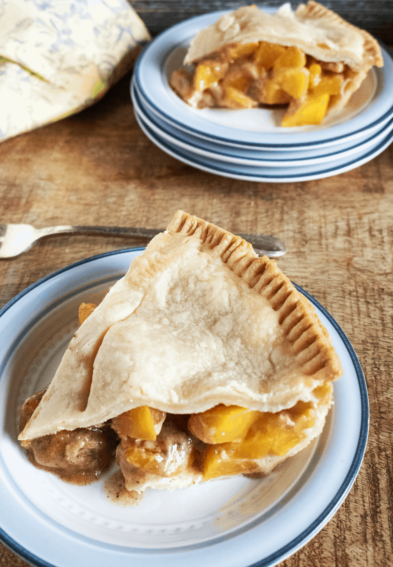 homemade peach pie on a plate