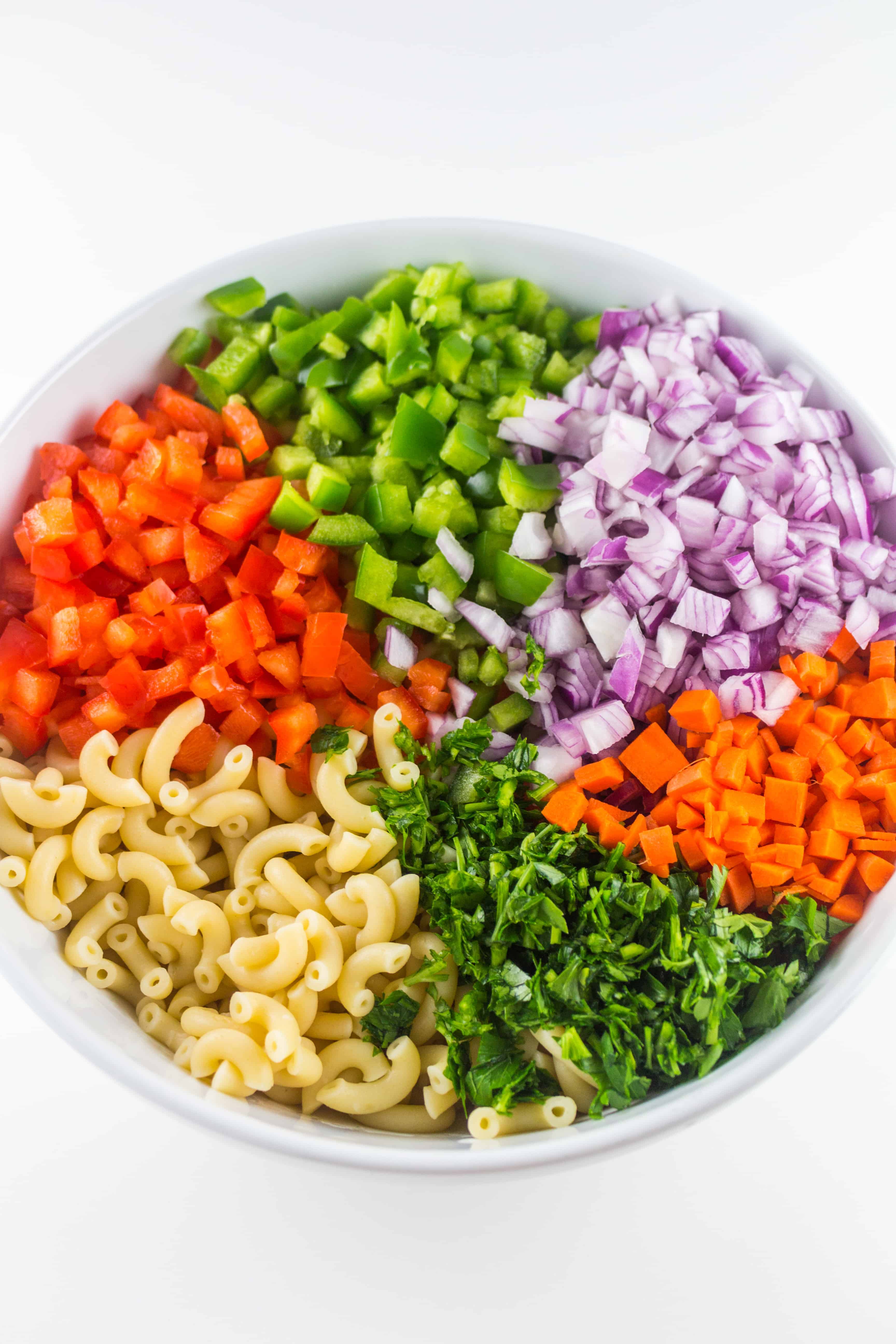 macaroni salad ingredients in a bowl