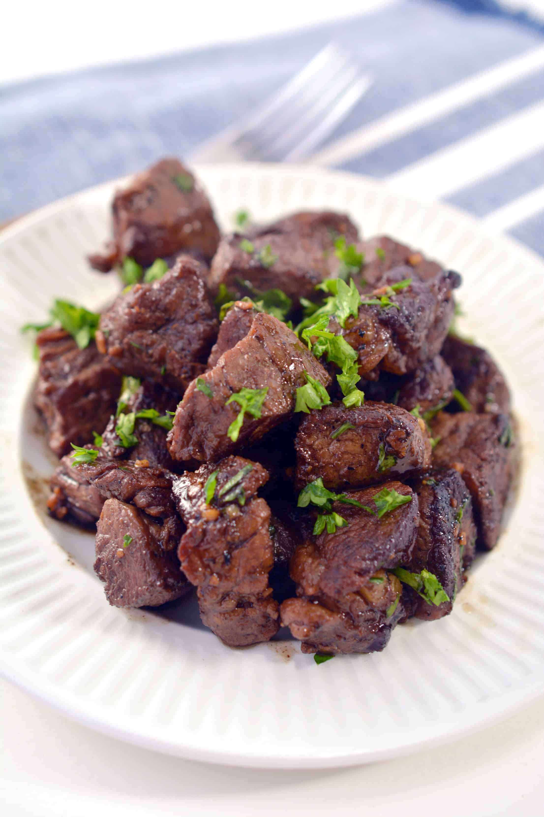 steak bites on white plate 