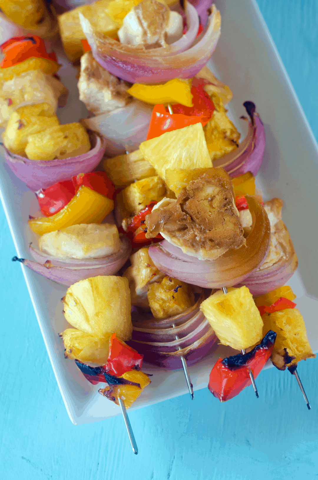 cooked chicken kabobs on a plate