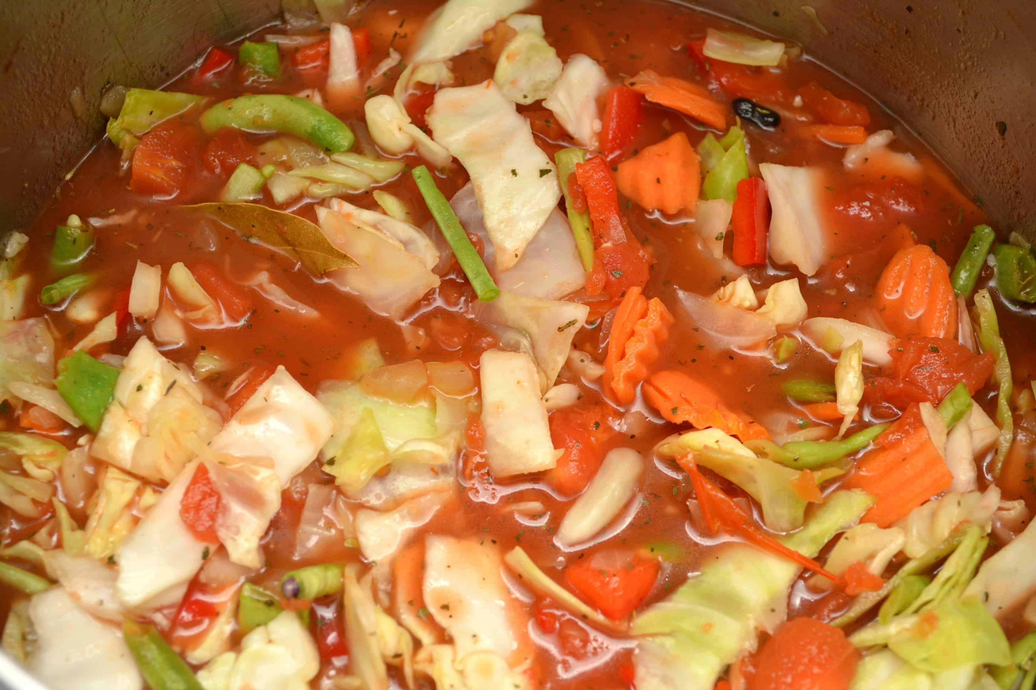 process of cabbage soup cooking in a big pot 