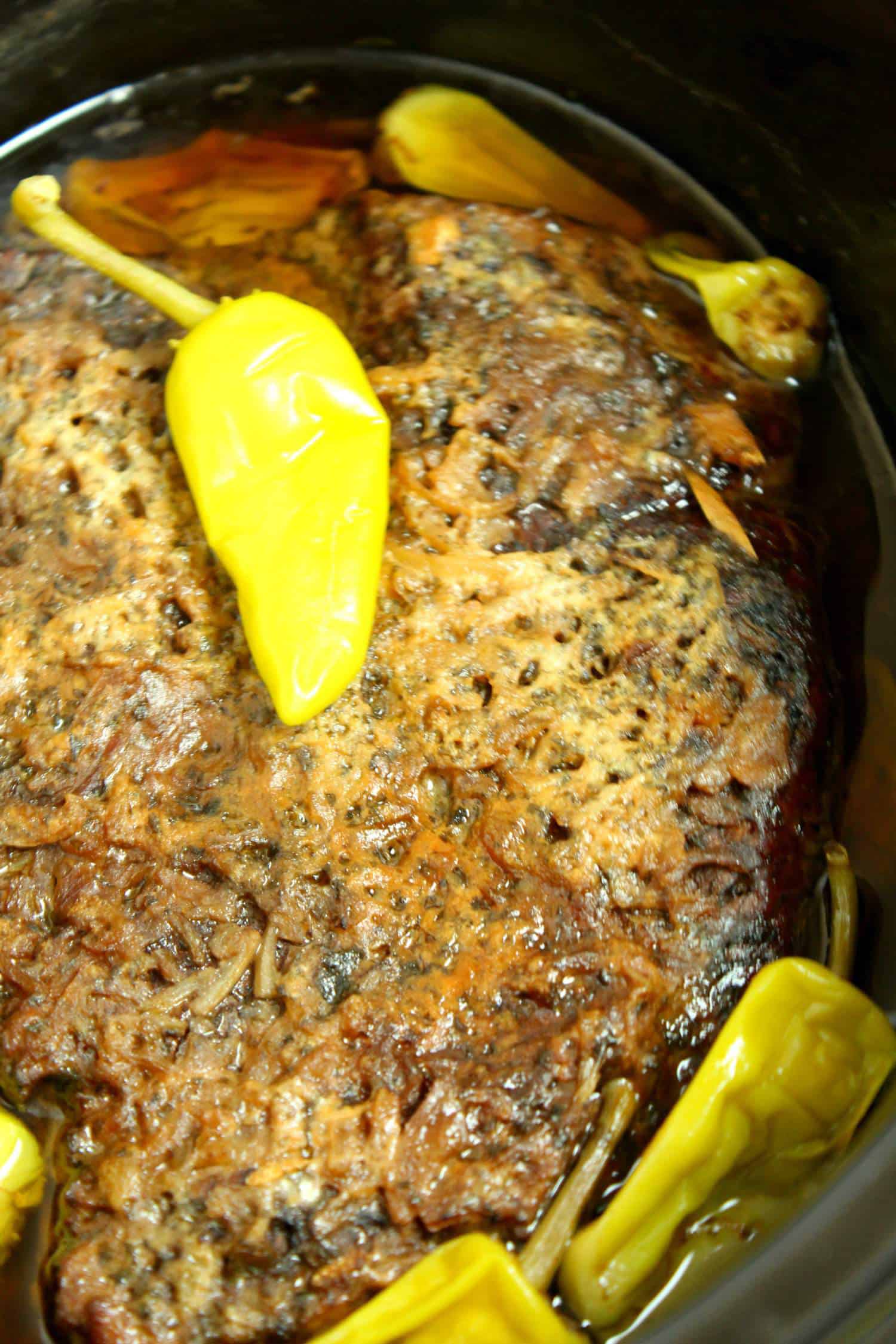 a seasoned pot roast in slow cooker 