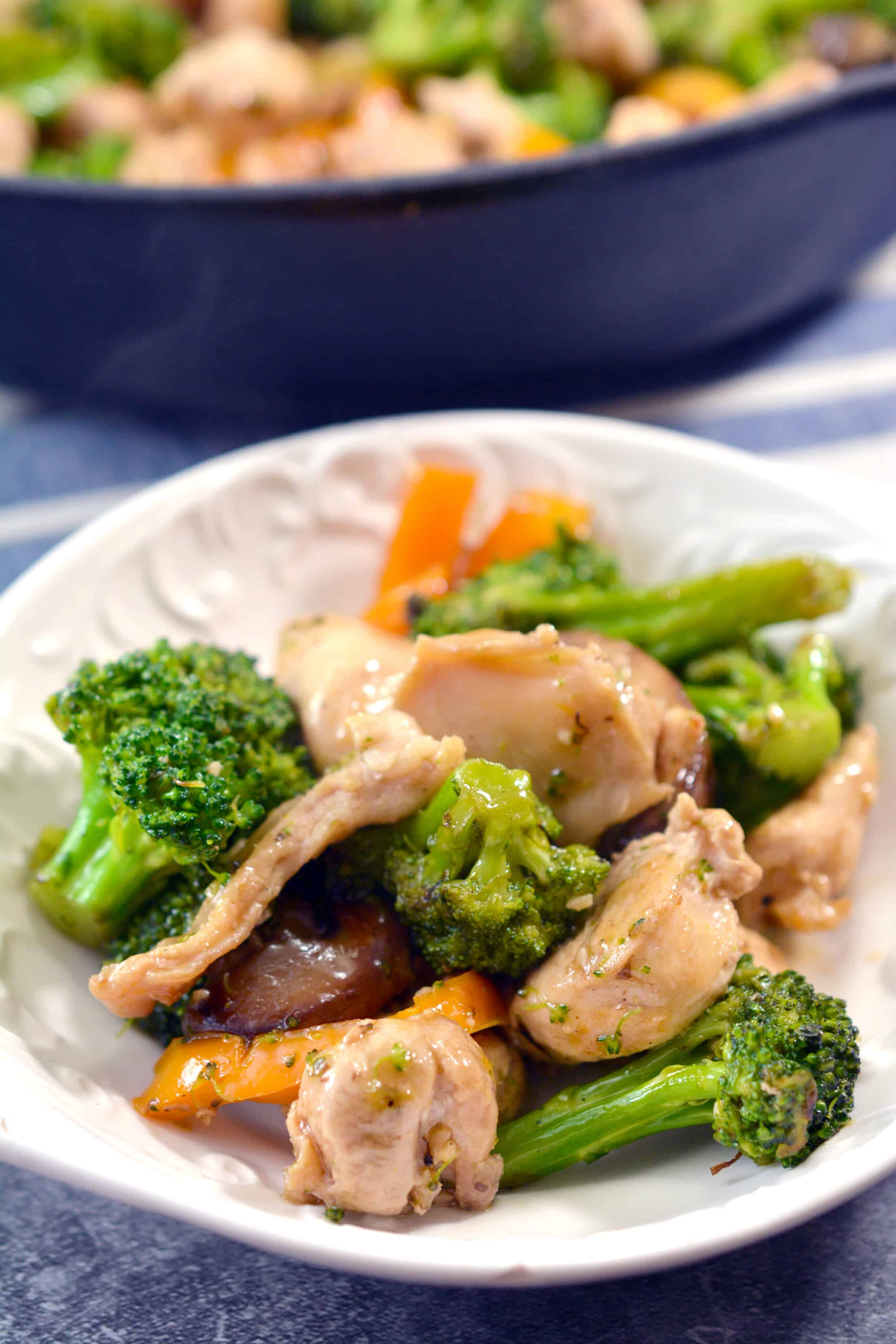 garlic chicken stir fry on a white plate