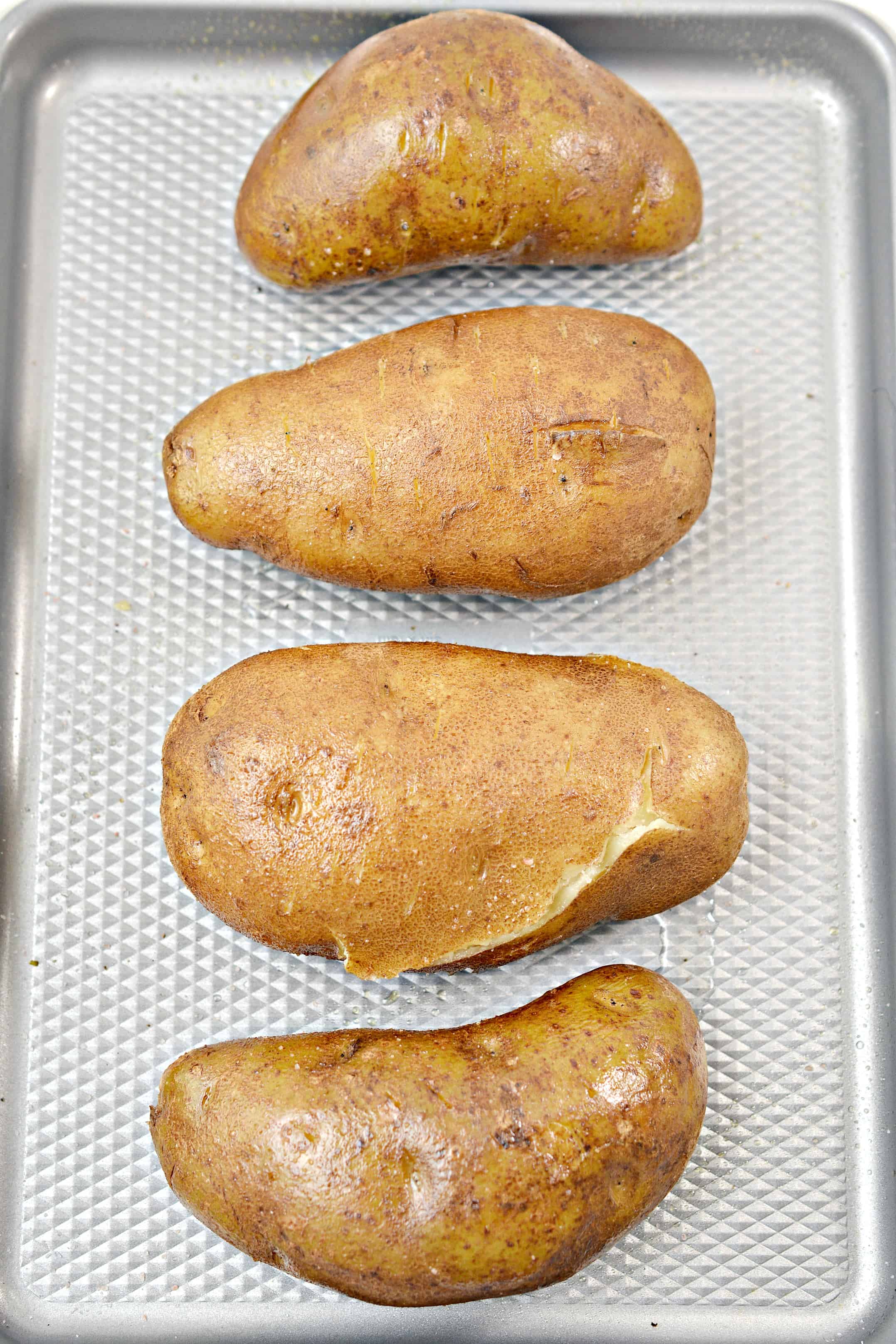 baked potatoes on a baking sheet