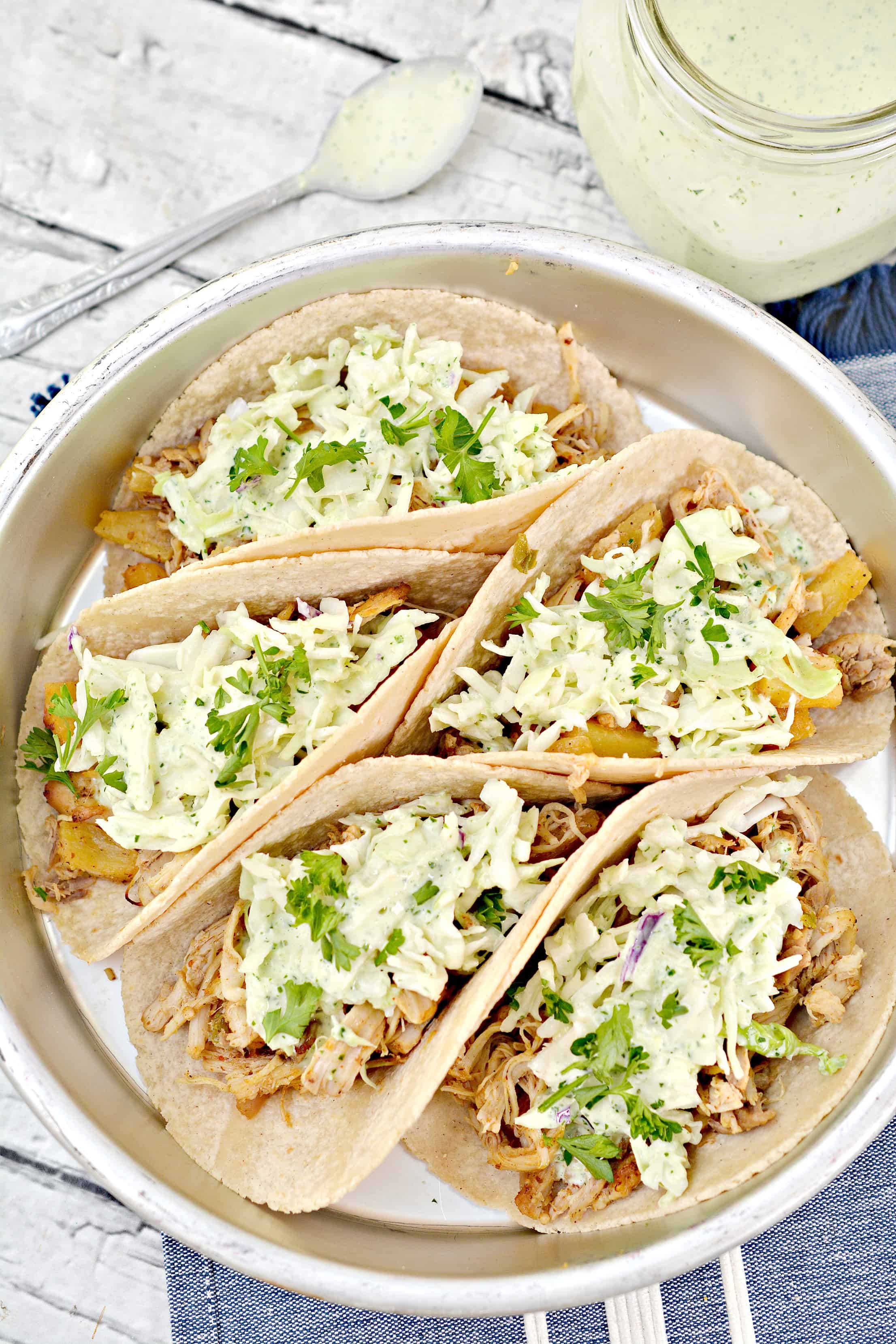 Overhead picture of prepared Instant pot chicken tacos on a silver platter