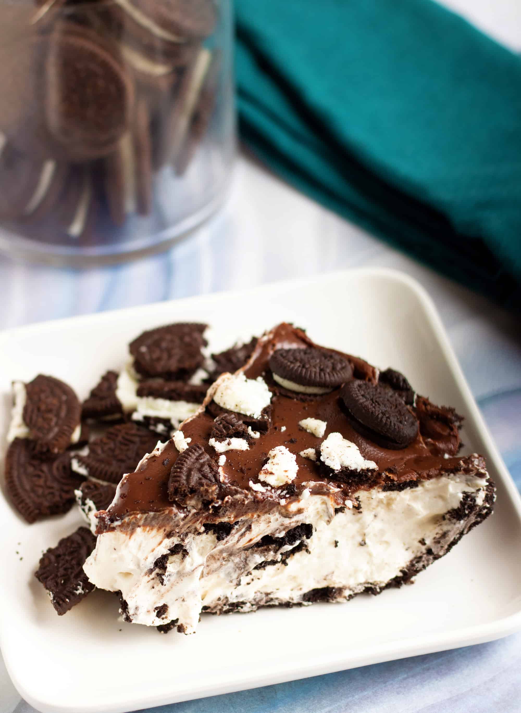 slice of no bake oreo pie with cookies on top