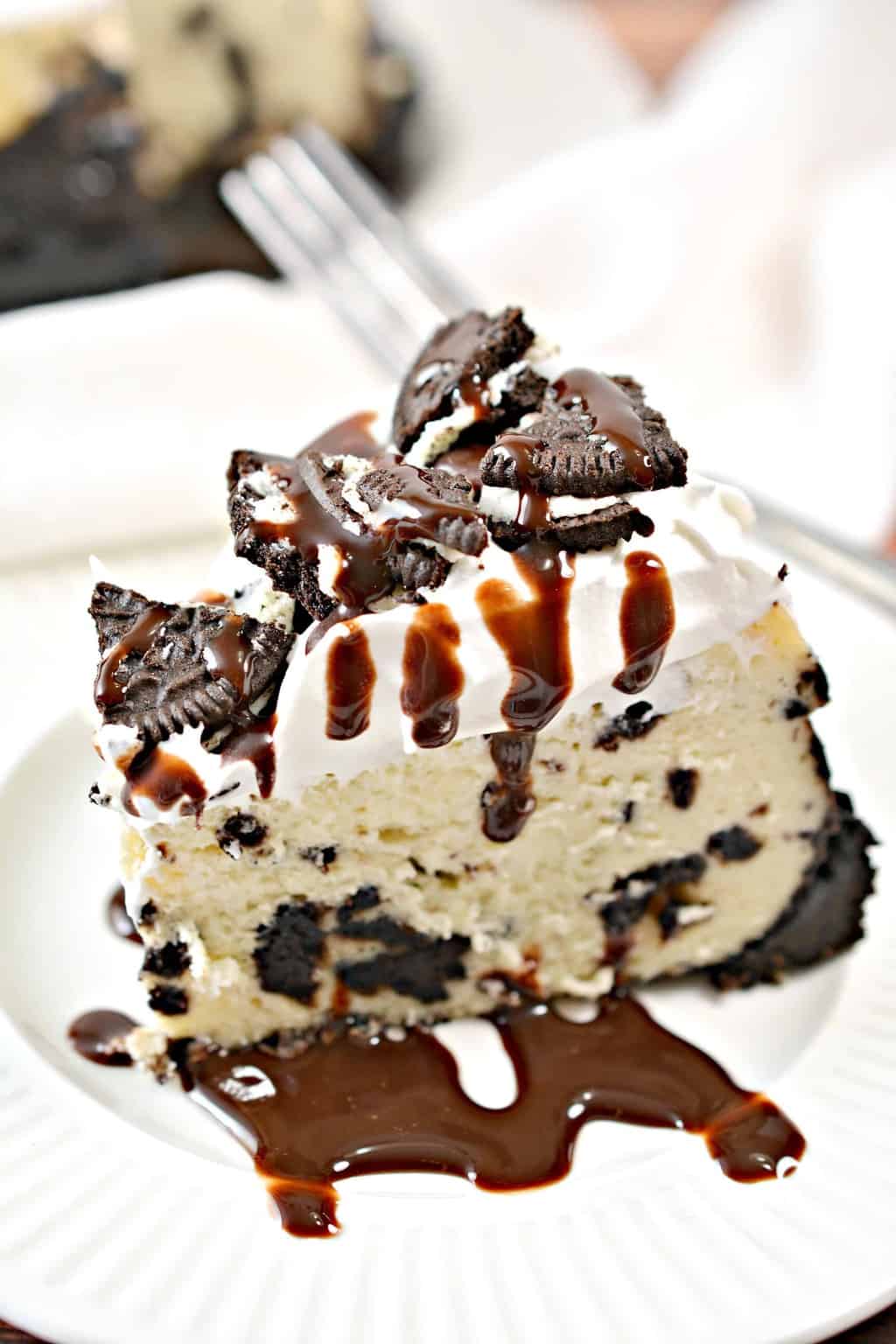 cookies and cream cheesecake on a white plate