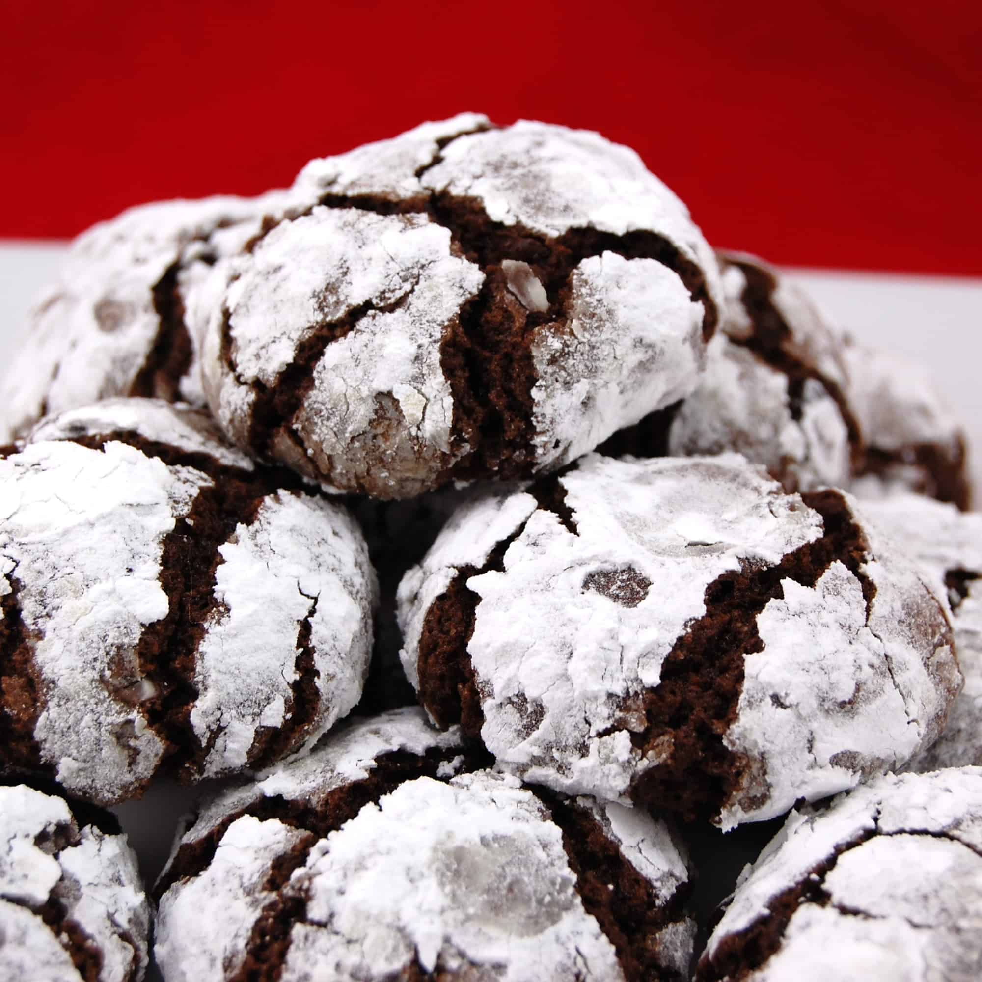 Black Forest Chocolate Crinkle Cookies with a red background