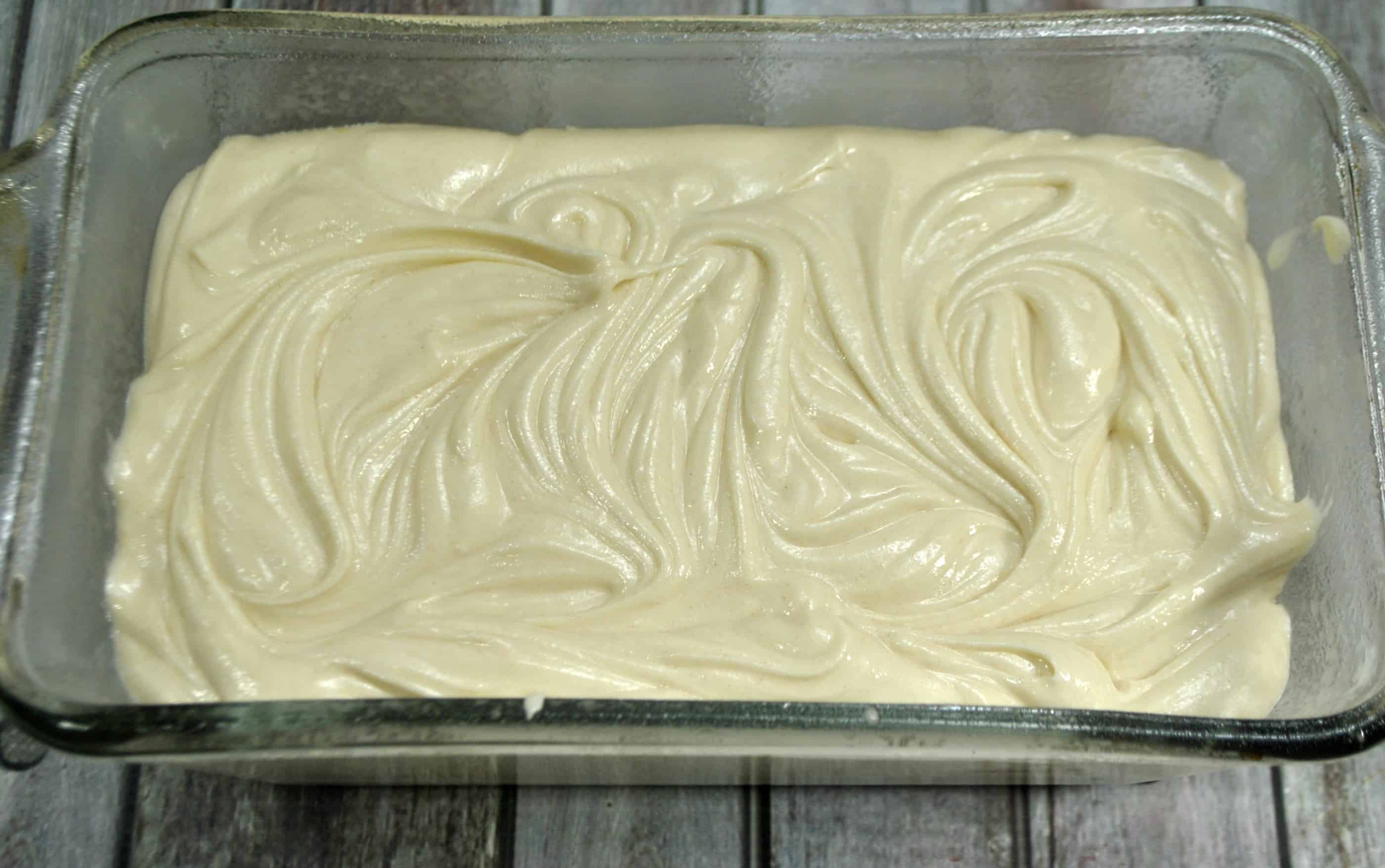 bread batter in a glass pan