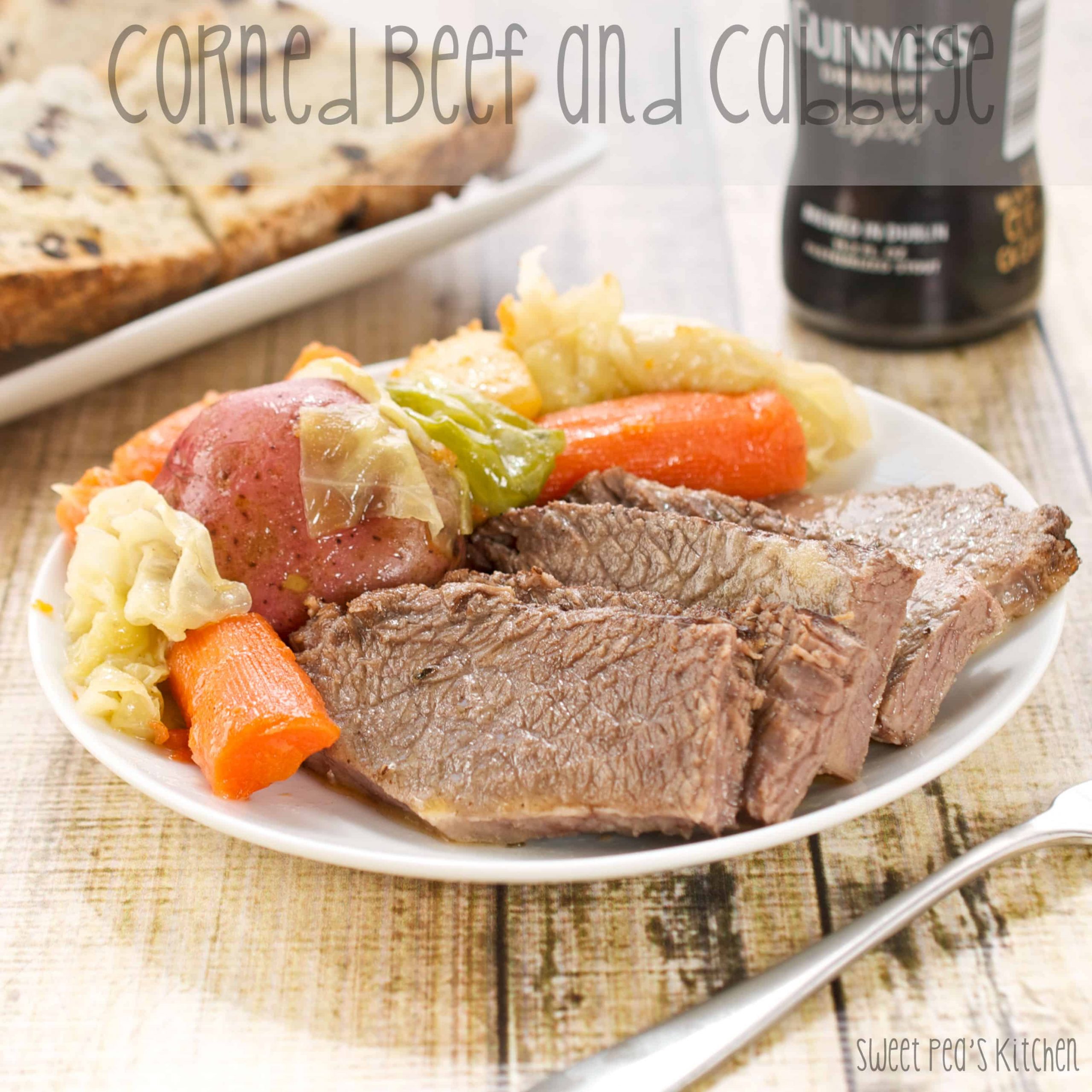 Easy Baked Corned Beef and Cabbage on a plate with vegetables