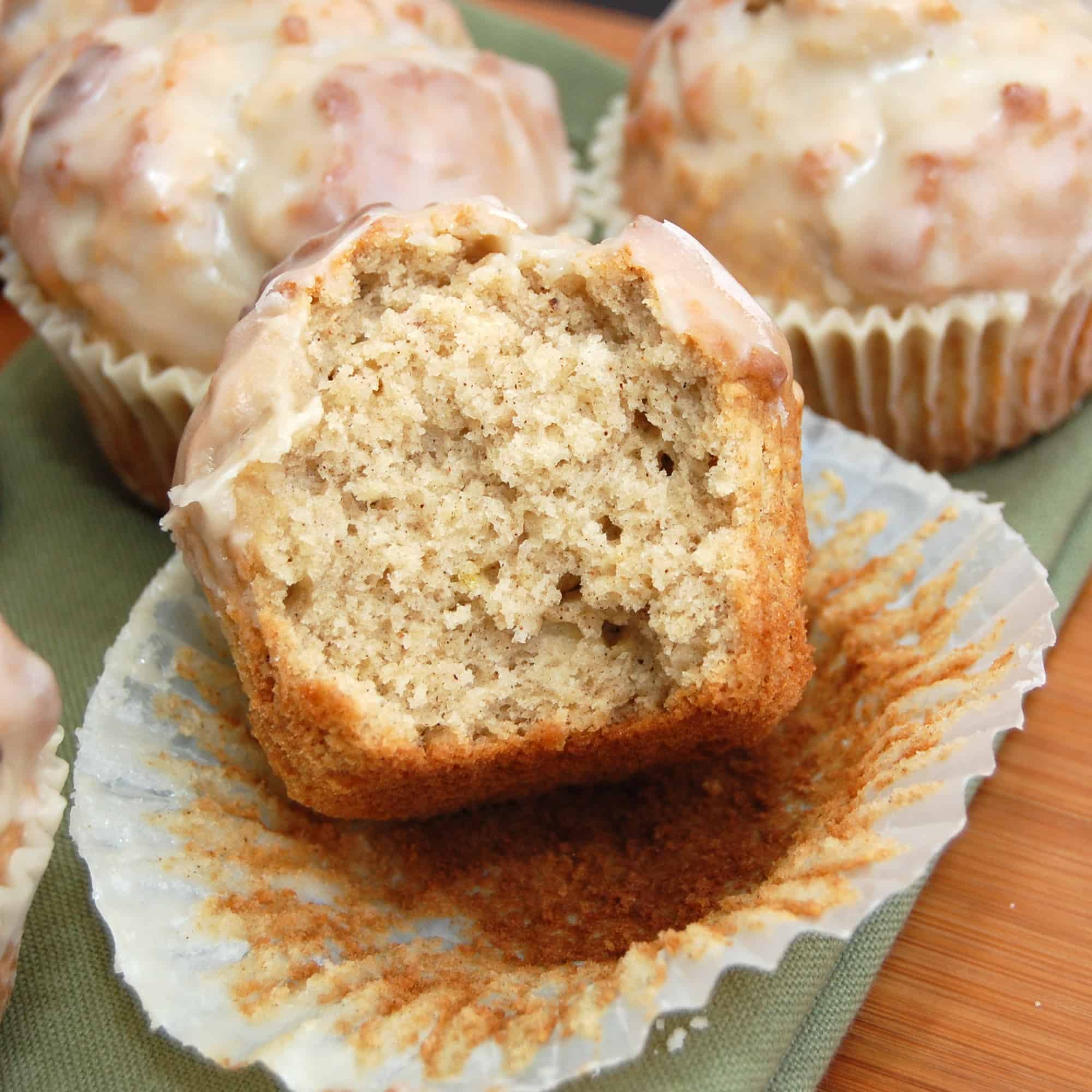 Glazed Donut Muffins on a green napkin and a bite out of it