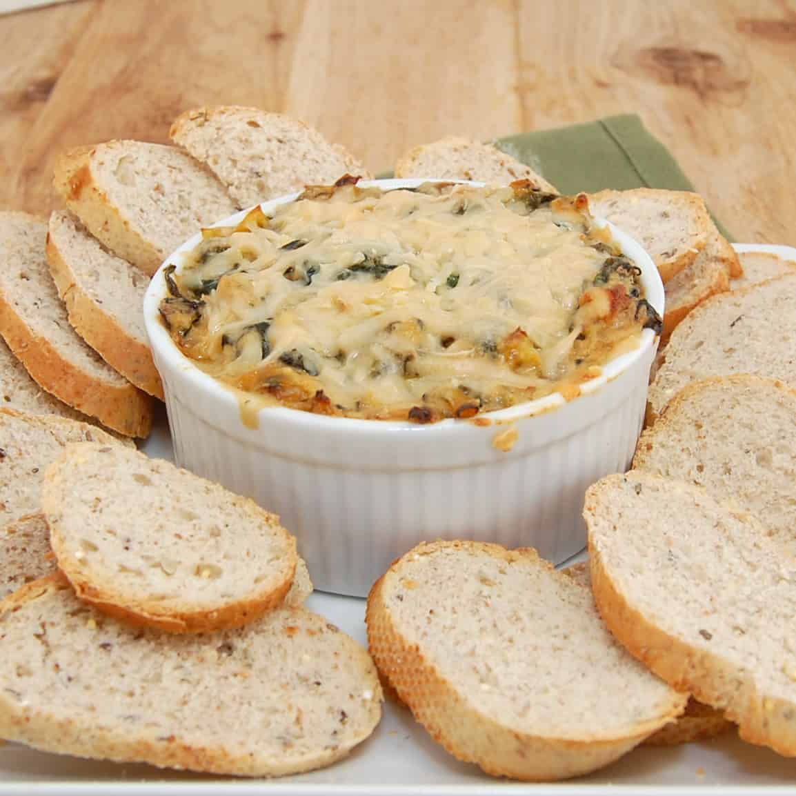 bowl of hot spinach artichoke dip