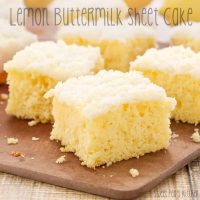 Up close picture of a moist lemon cake recipe cut into pieces on a cutting board