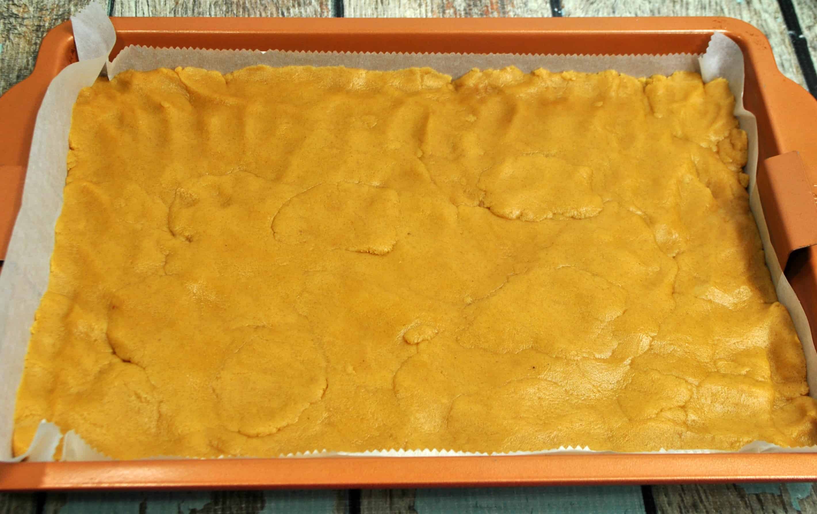 The peanut butter base in a baking pan