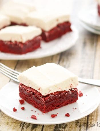 A single slice of red velvet brownies sitting on a white saucer