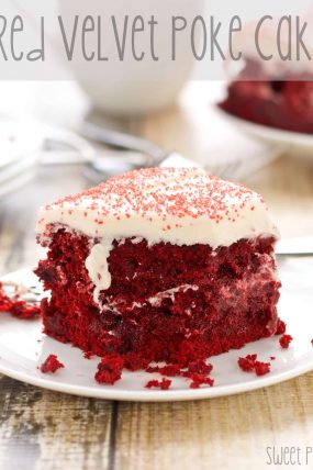 several pieces of red velvet poke cake on plates