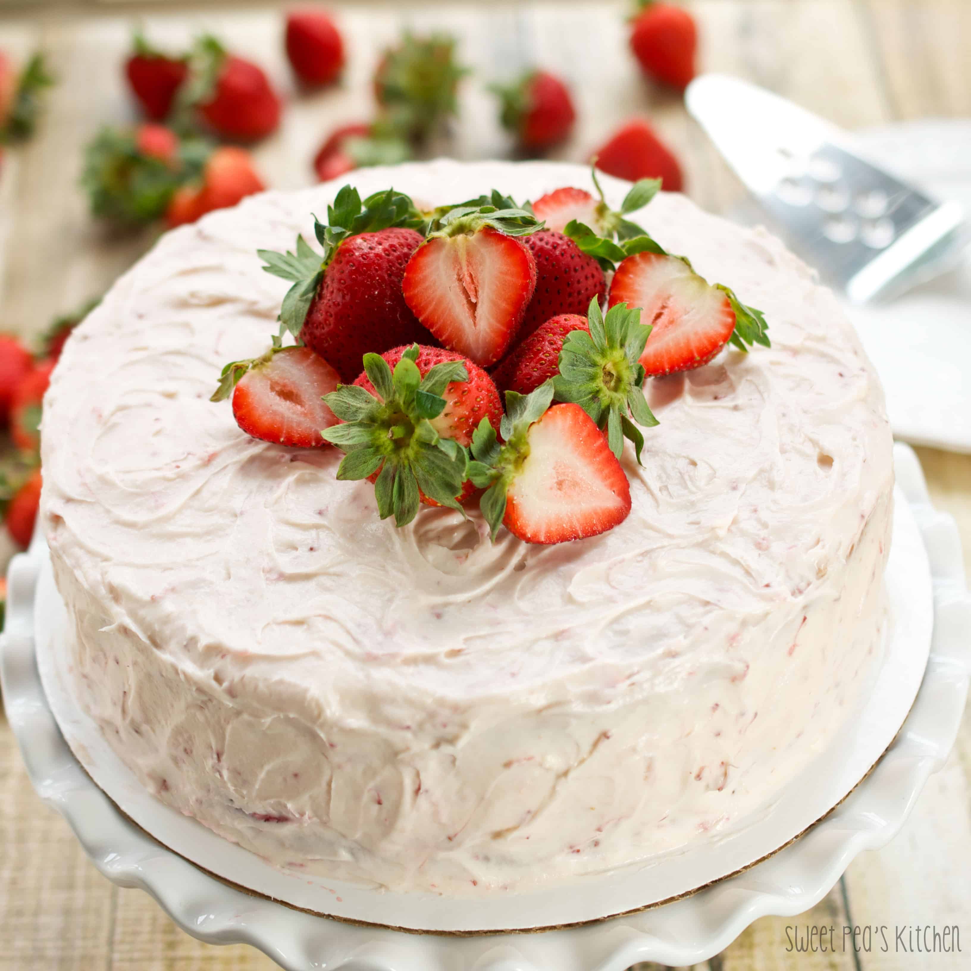 strawberry layer cake with strawberries on top