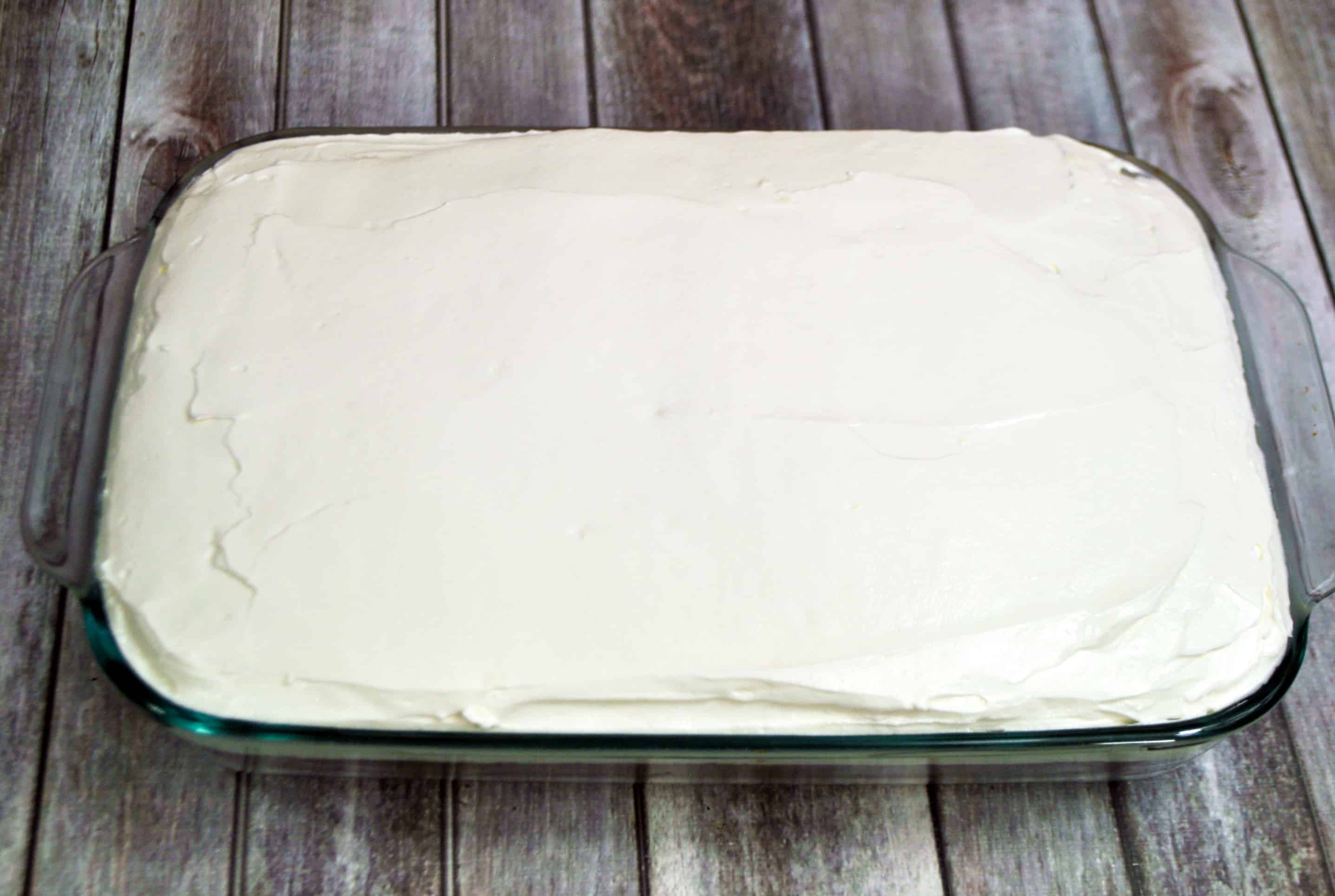 frost the cake with cream cheese whipped cream frosting