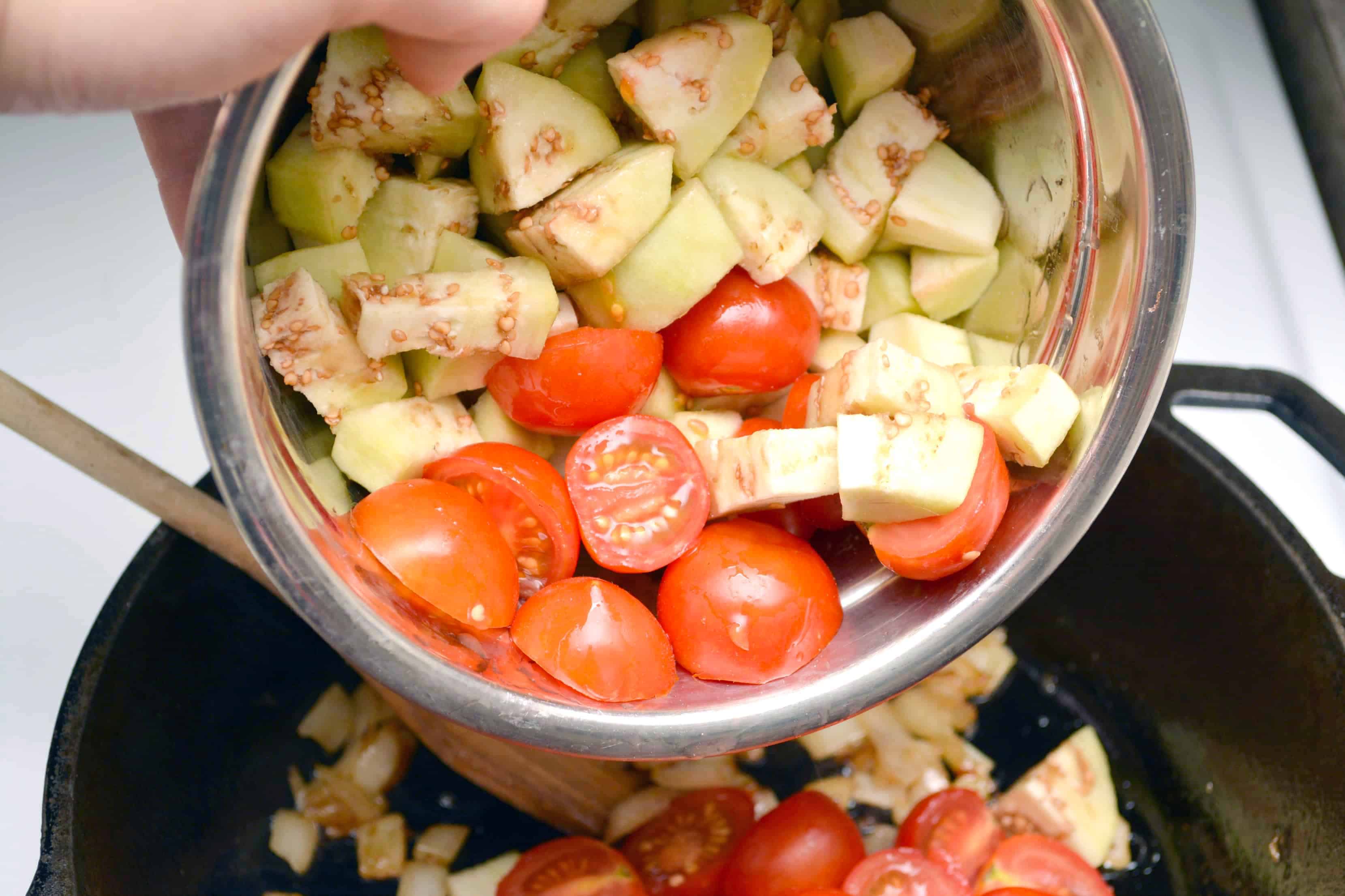 Add tomatoes and eggplant to skillet