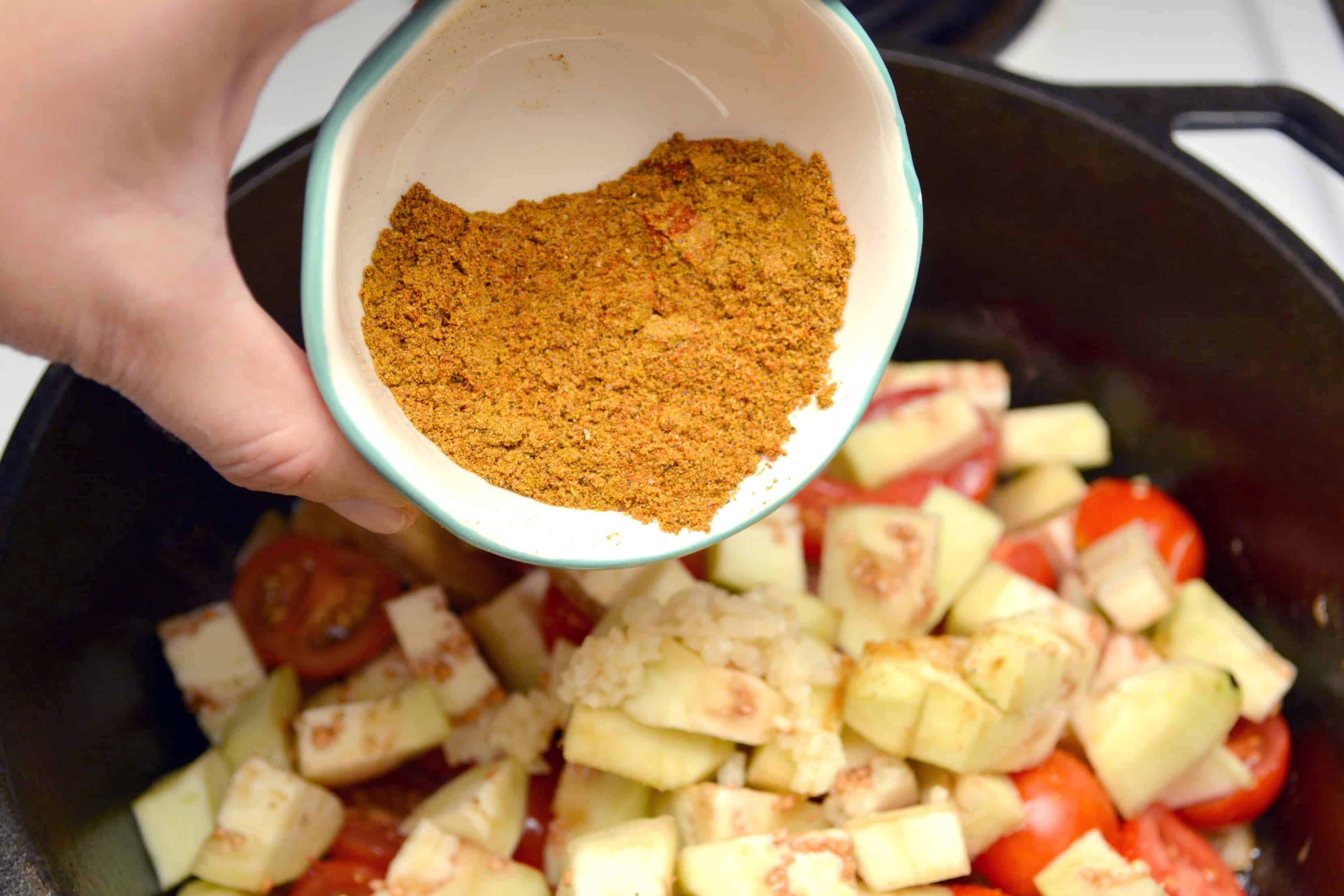 add seasoning to the vegetables in the skillet