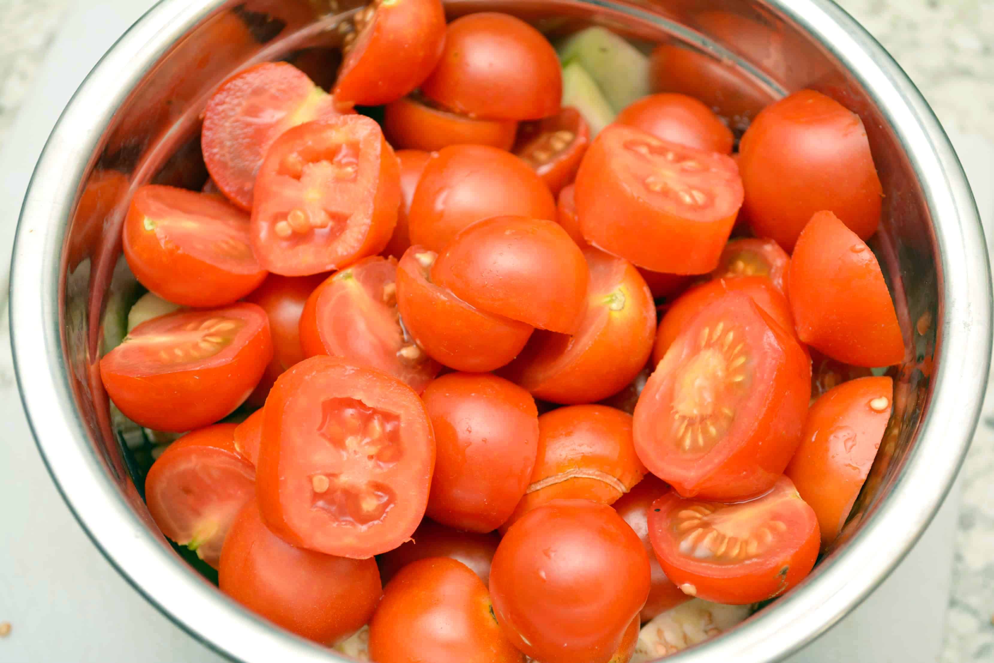 halved cherry tomatoes in a bowl