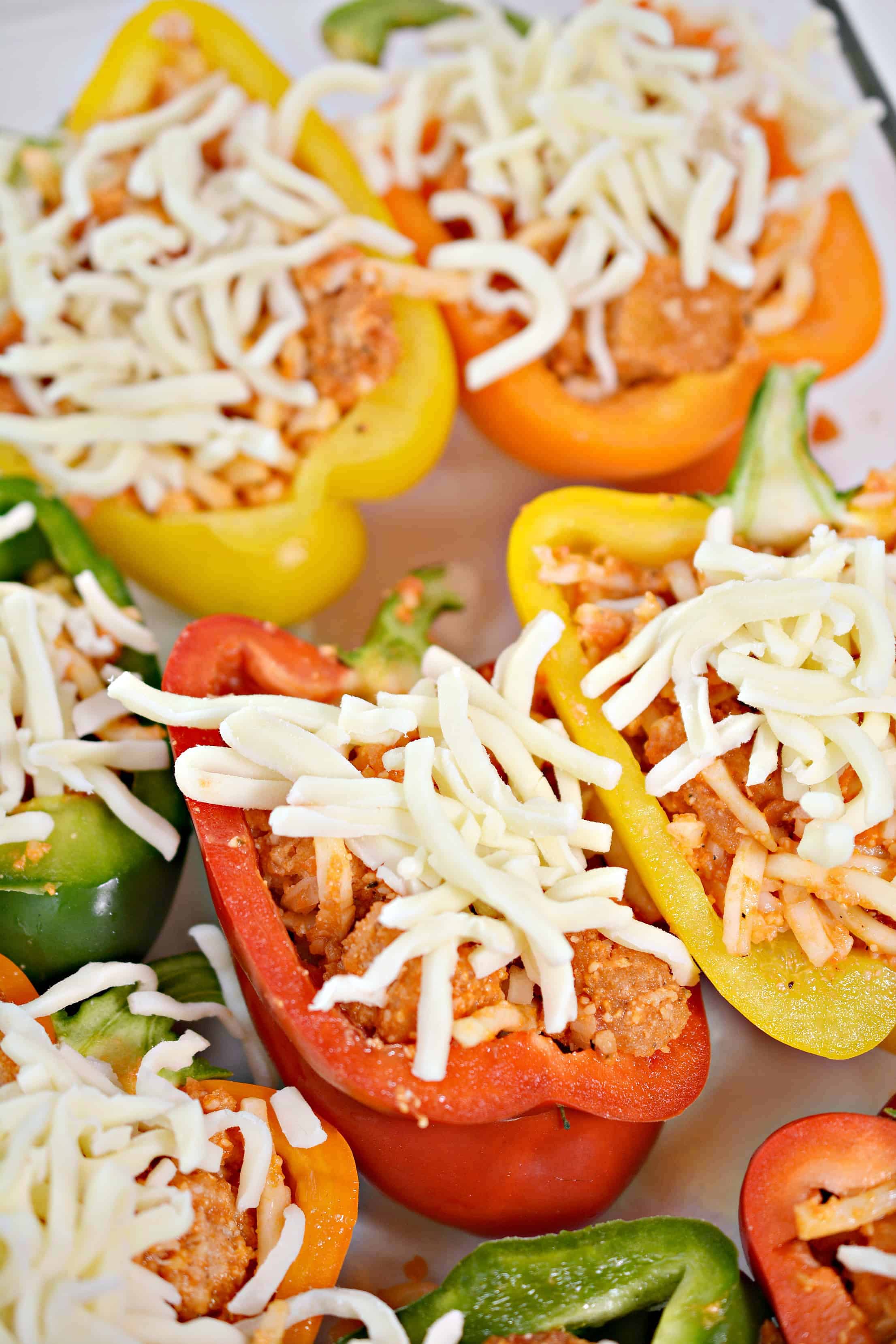 Add cheese to the top of bell peppers