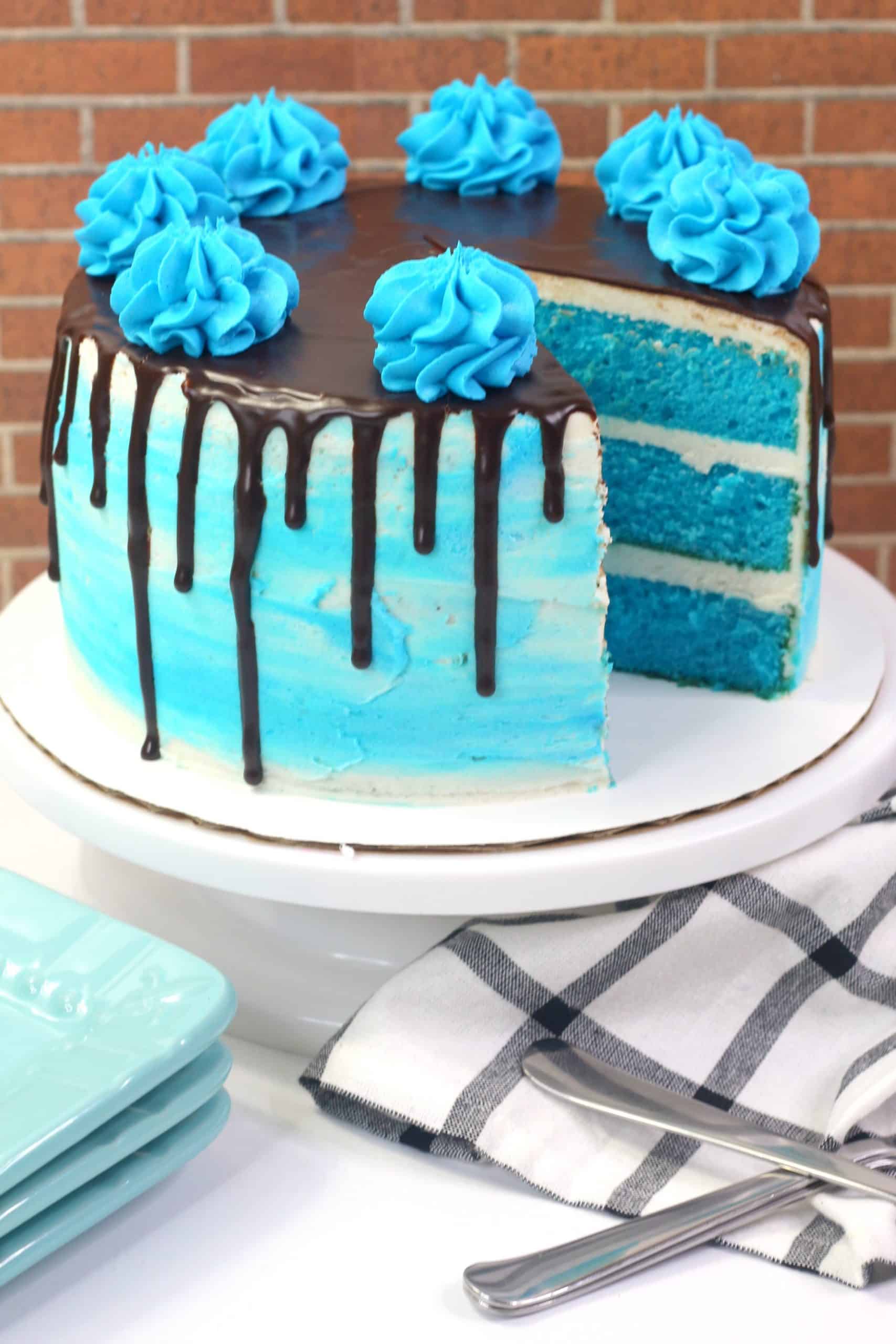 Pastel Blue Cake With Baby Figurine