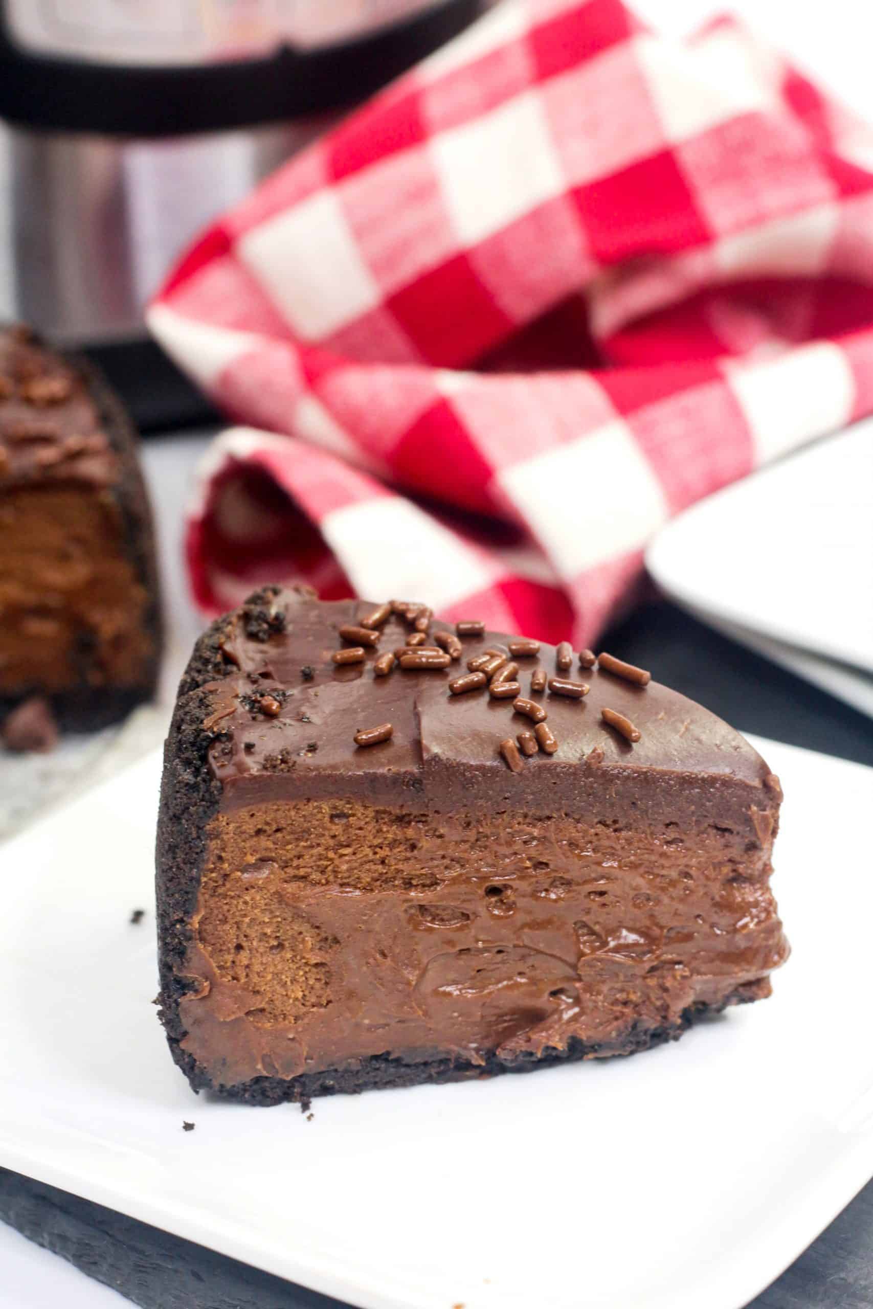 triple chocolate Instant Pot Cheesecake on a white plate