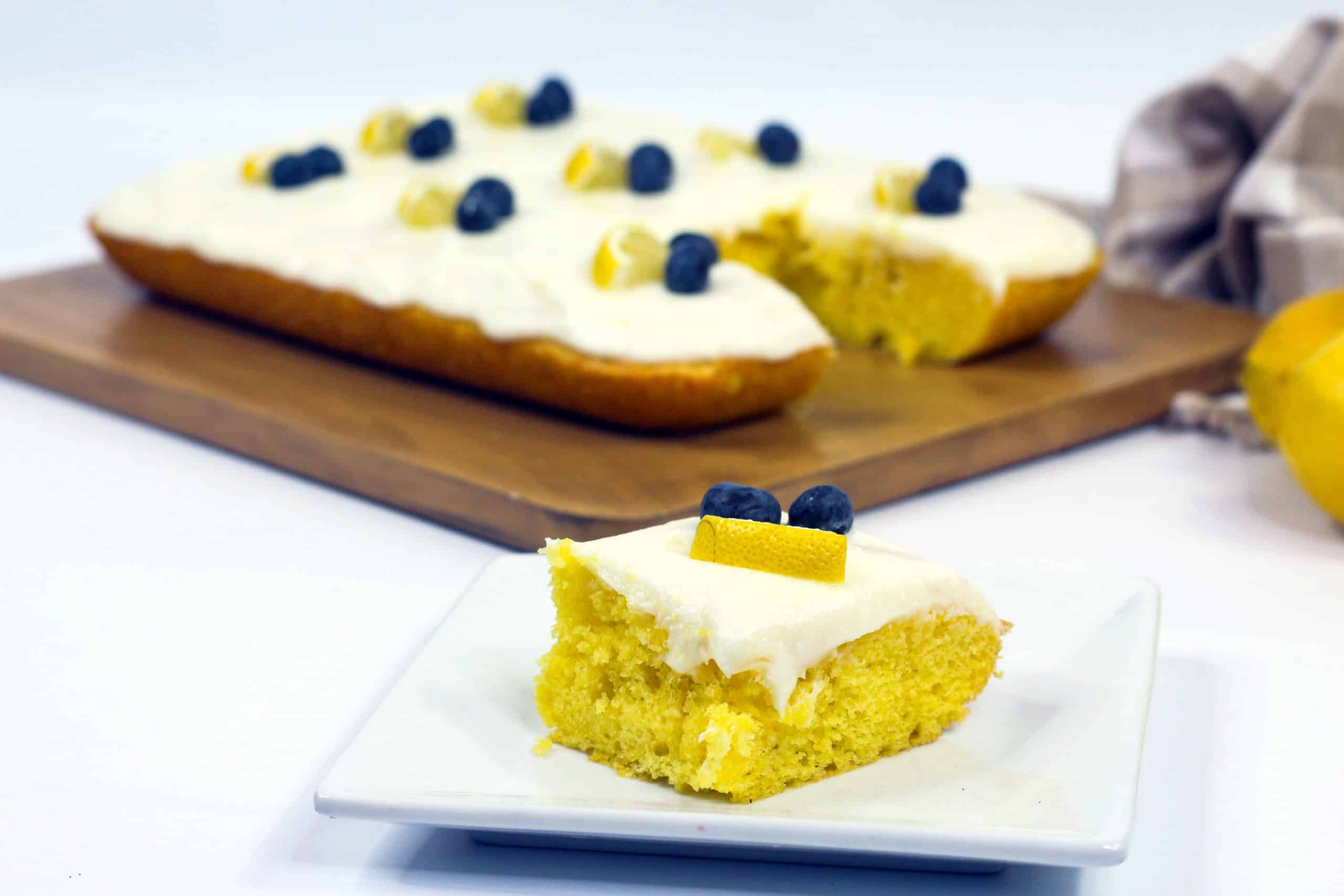 Slice of lemon sheet cake on plate