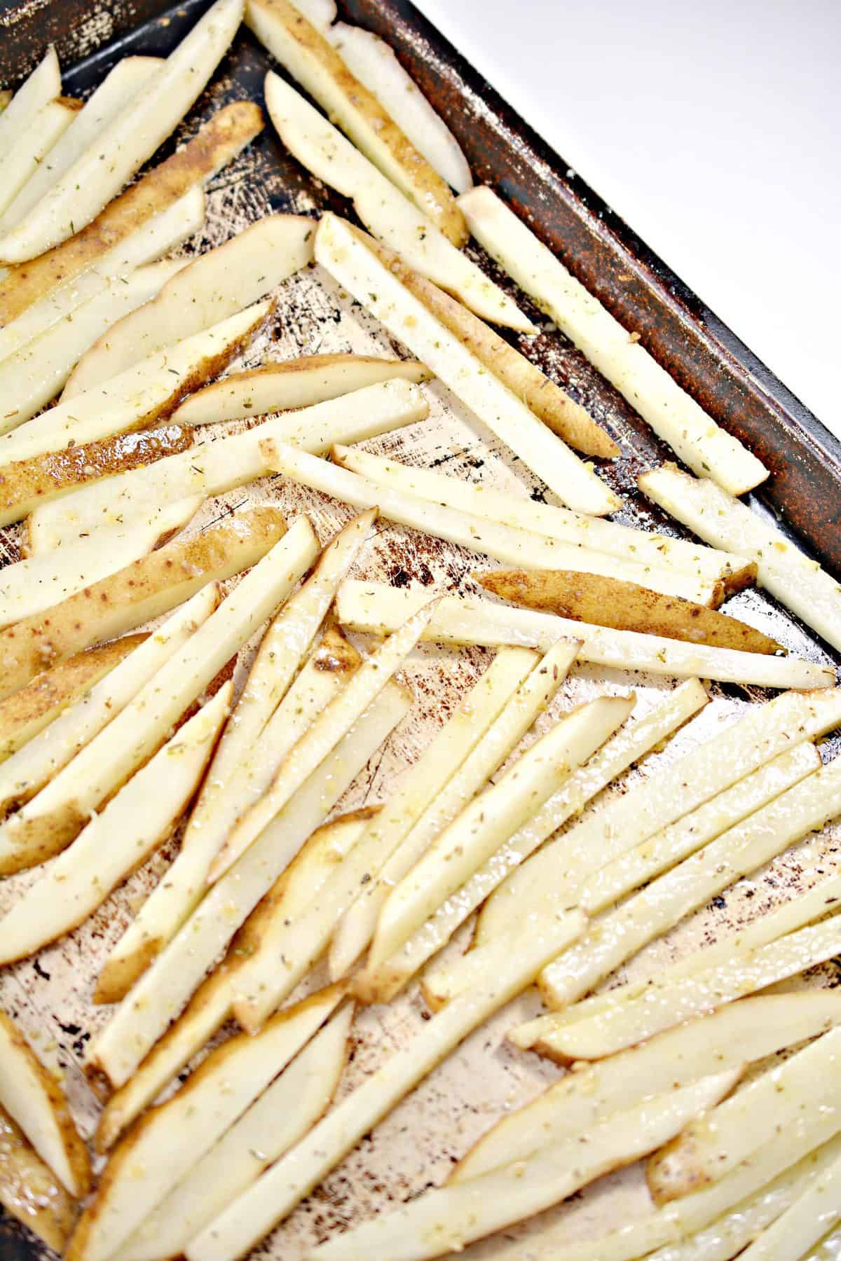 Spread the fries out in an even layer on a baking sheet.