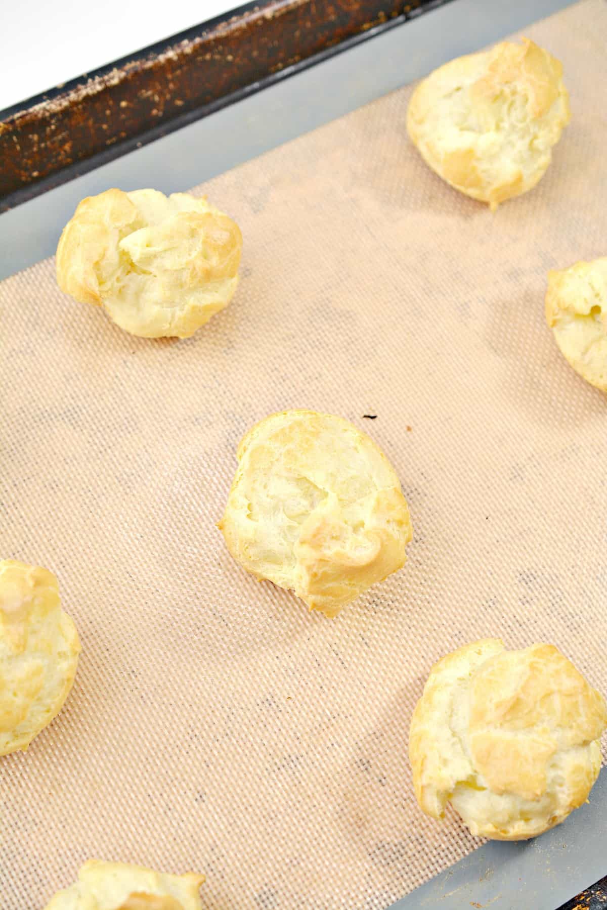 Use a cookie scoop or tablespoon to put drops of batter onto a parchment or silicone mat-lined baking sheet.