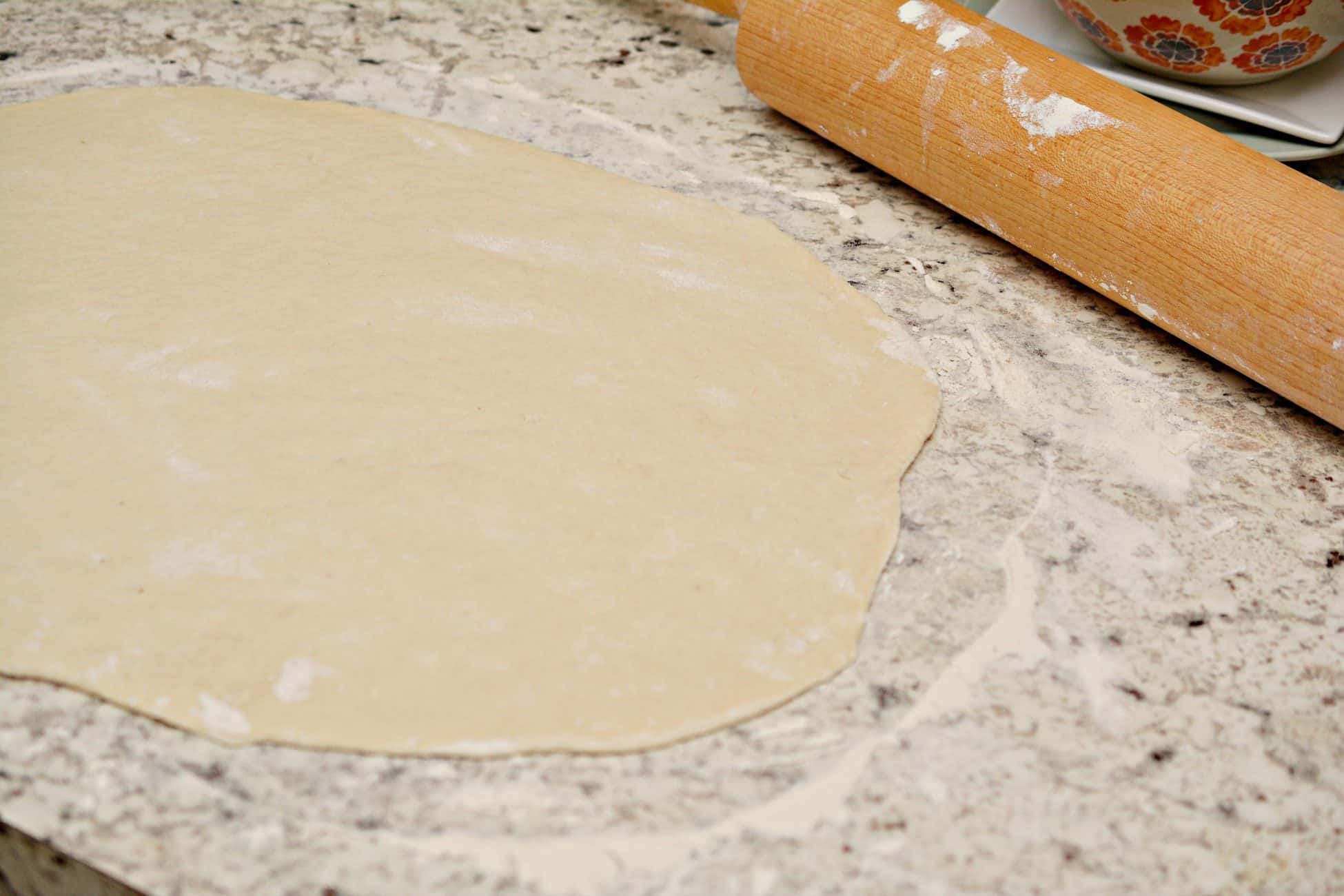 Lay a bit of flour out on a clean dry surface.