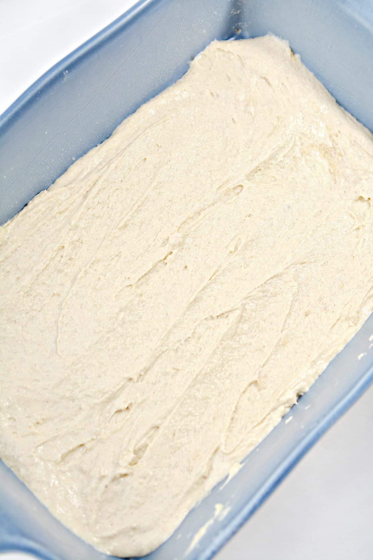 Place half of the cake batter in an even layer in the bottom of a well-greased baking dish.